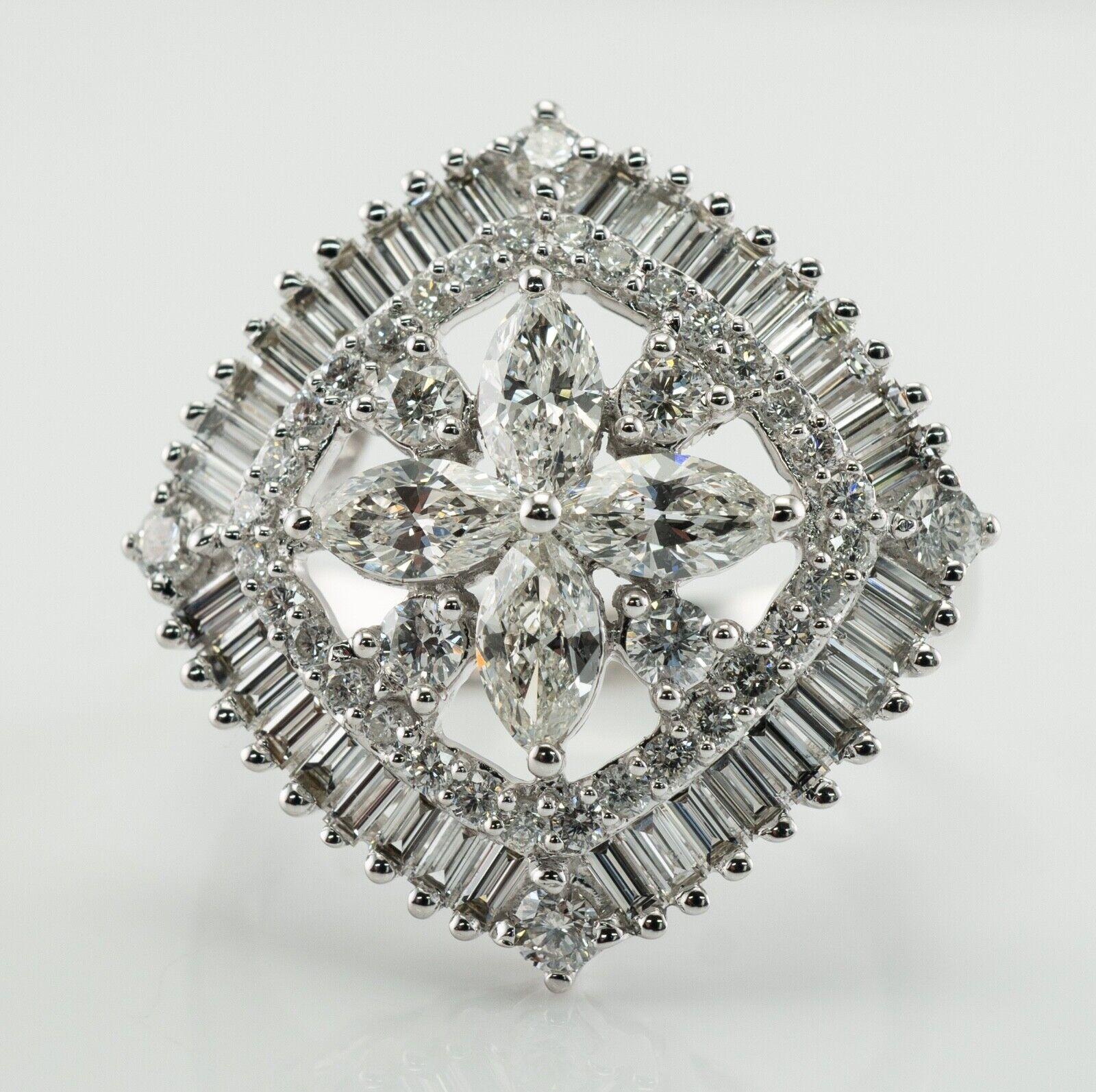 This spectacular ring is finely crafted in solid 14K White Gold. 
Four center marquise diamonds are VS1 clarity and H color totaling .60 carat.
Eight (4+4) round brilliant cut diamonds in the center total .26 carat of SI1 clarity and H color.
32