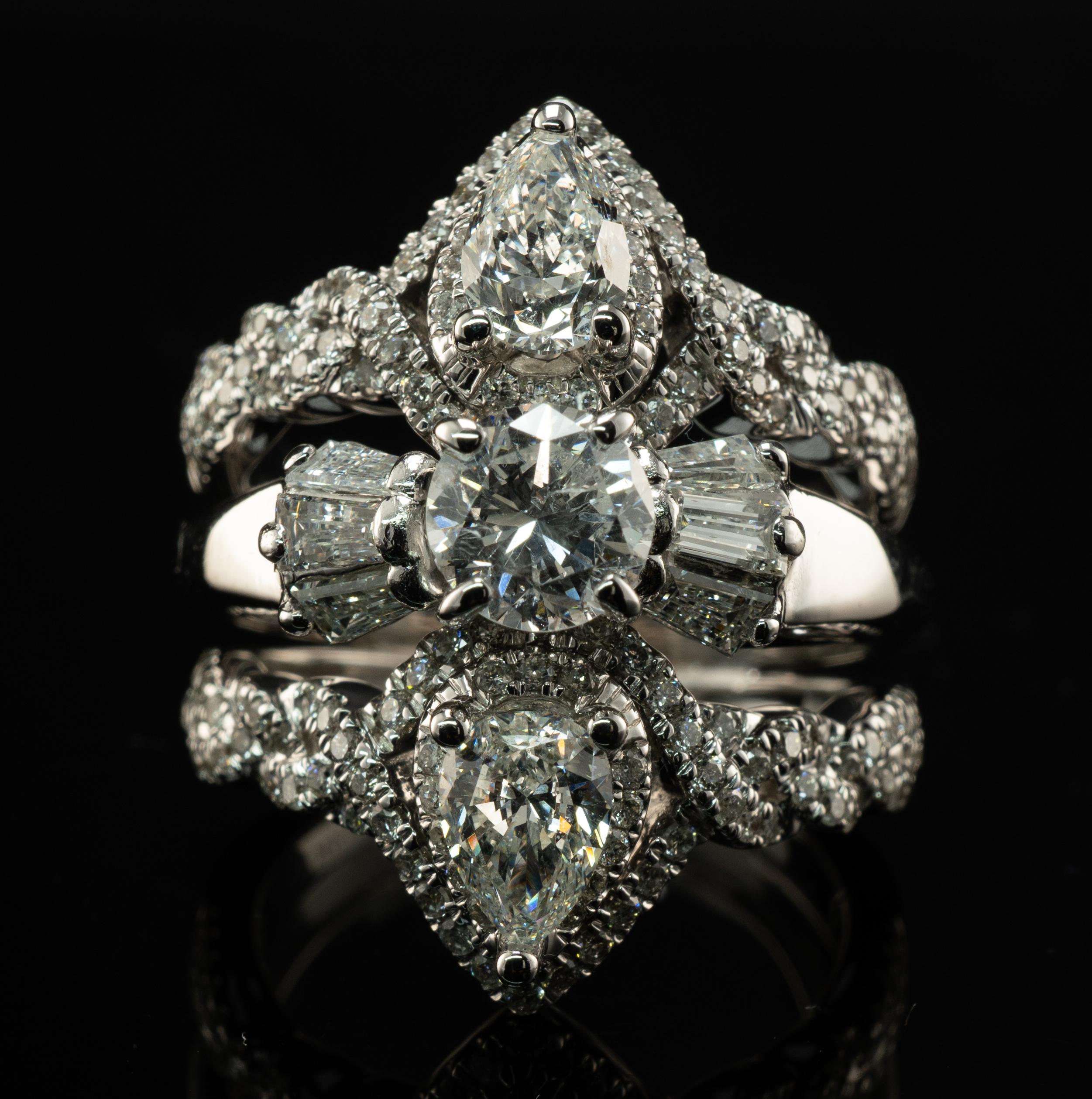 
Natural Diamond Ring 14K White Gold Cluster Cocktail 3.82 TDW Triple Bands

This spectacular ring is finely crafted in solid 14K White Gold.
The center round brilliant cut diamond is .90 carat of SI1 clarity and G color.
Two pear cut diamonds total