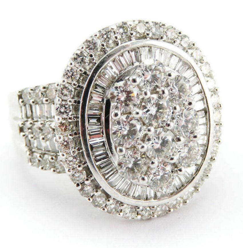Natural Diamond Ring 14K White Gold Cocktail 2.44 TDW Zai Cluster

This stunning large ring is finely crafted in solid 14K White Gold and set with white and fiery diamonds.
Ten round brilliant cut diamonds in the center total .30 carat of SI1