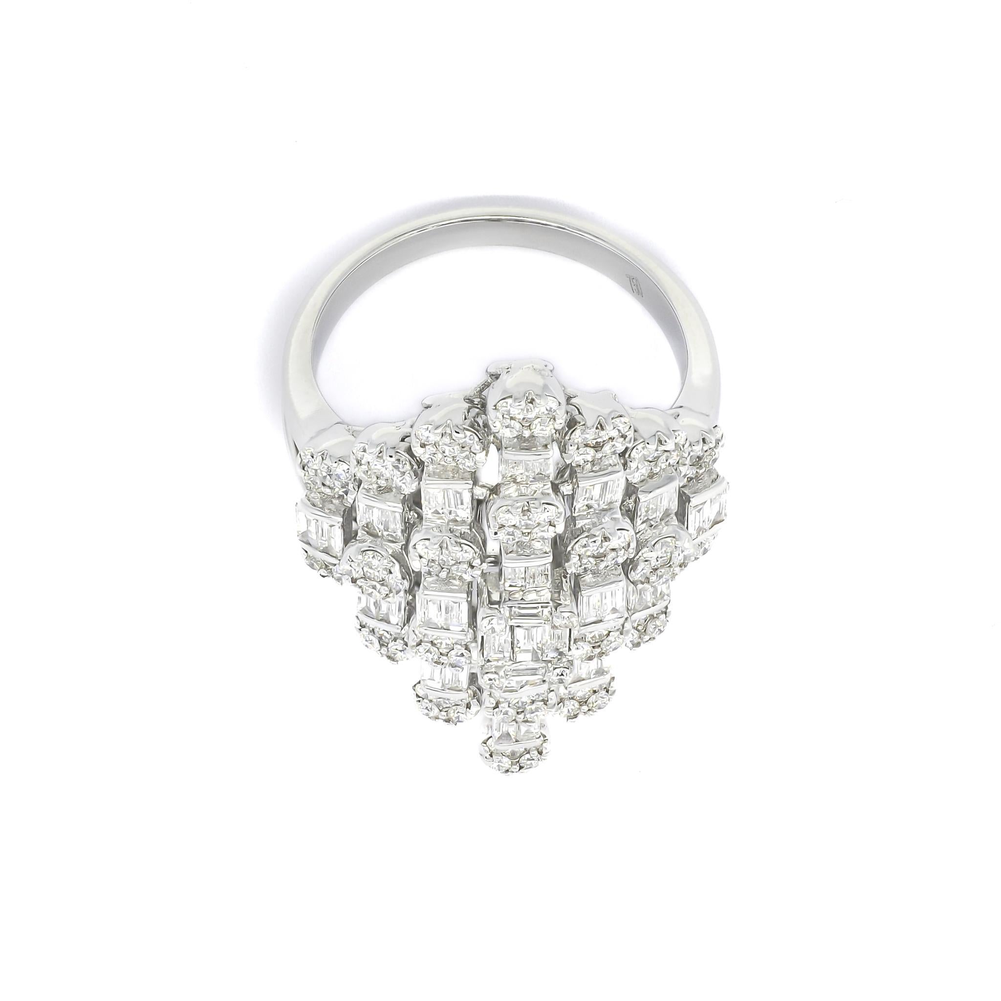 Immerse yourself in the captivating allure of this statement-making 18 KT White Gold ring, adorned with bold geometric vertical settings of baguette and round diamonds totaling 1.64 carats. The unique design of this ring features a striking