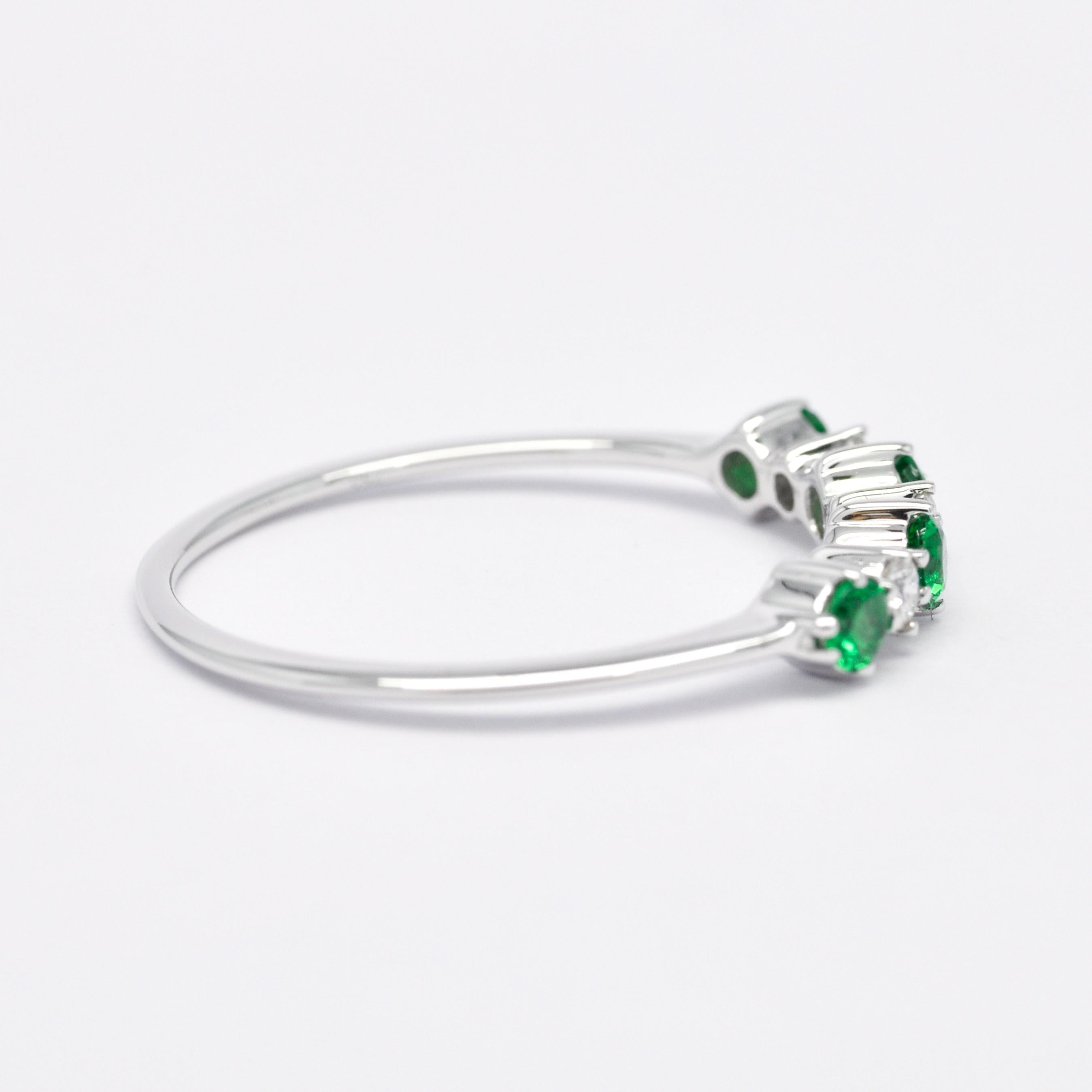 The inclusion of Emerald Green Stones and Diamonds 18kt White Gold Ring enriches its symbolism and visual appeal, elevating it to an even more captivating piece for engagements and anniversaries alike.

Emerald green, with its lush and verdant hue,