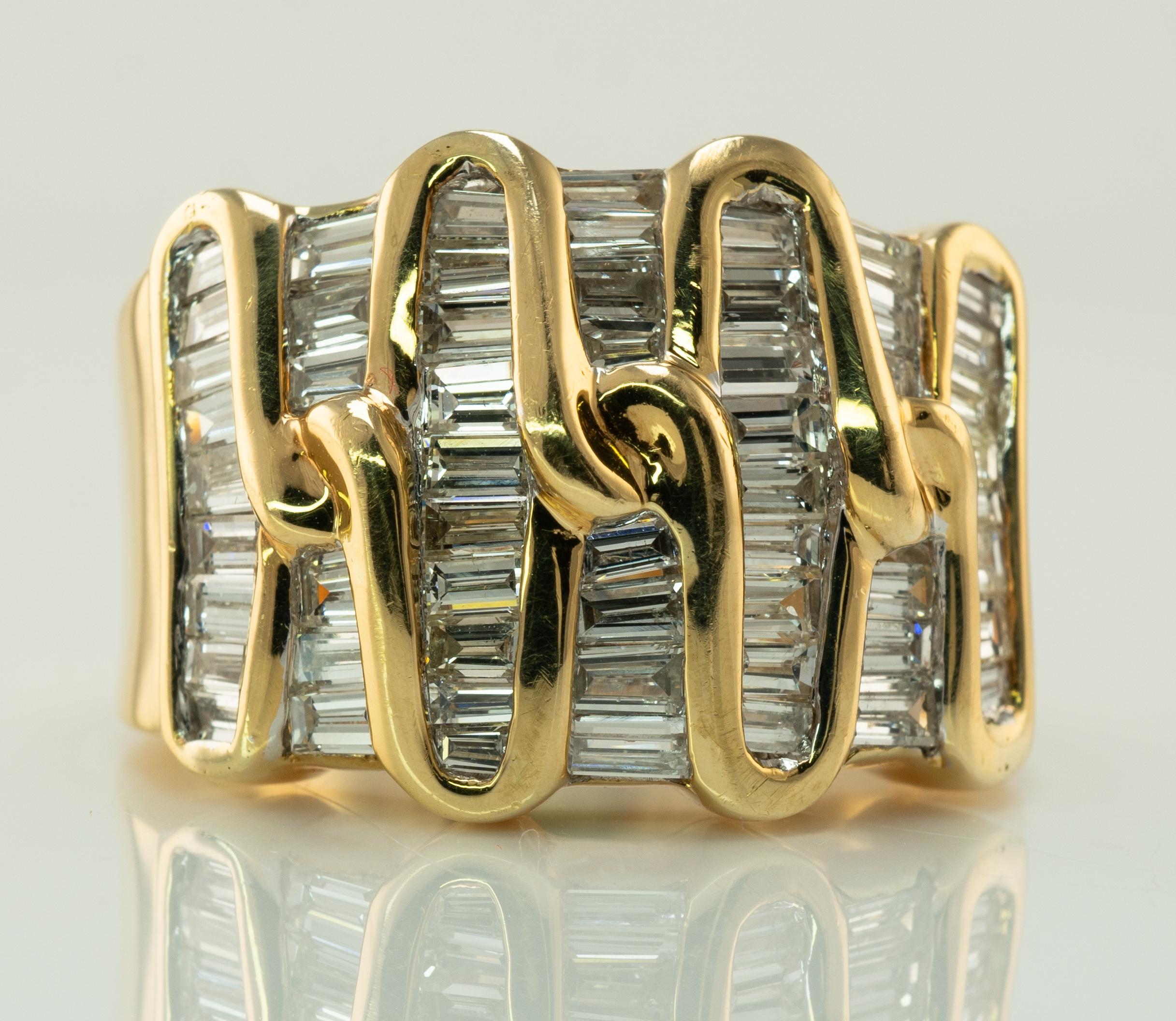 Natural Diamond Ring 18K Gold Cluster Cocktail 1.89 TDW Band Band Estate

This absolutely stunning estate ring is finely crafted in solid 18K Yellow Gold and set with genuine Diamonds. 
There are 56 channel set diamonds ranging from VS2- SI1 clarity