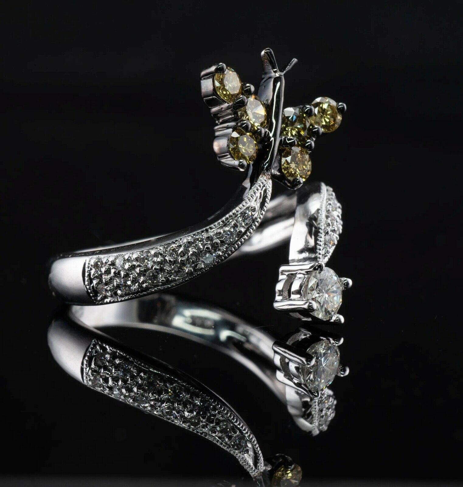 Natural Diamond Ring Butterfly 18K White Gold Estate

This pretty estate ring is crafted in solid 18K White gold. 
Six canary round brilliant cut diamonds are set in blackened gold and they total .36 carat of VS2 clarity. 
One white diamond is.15