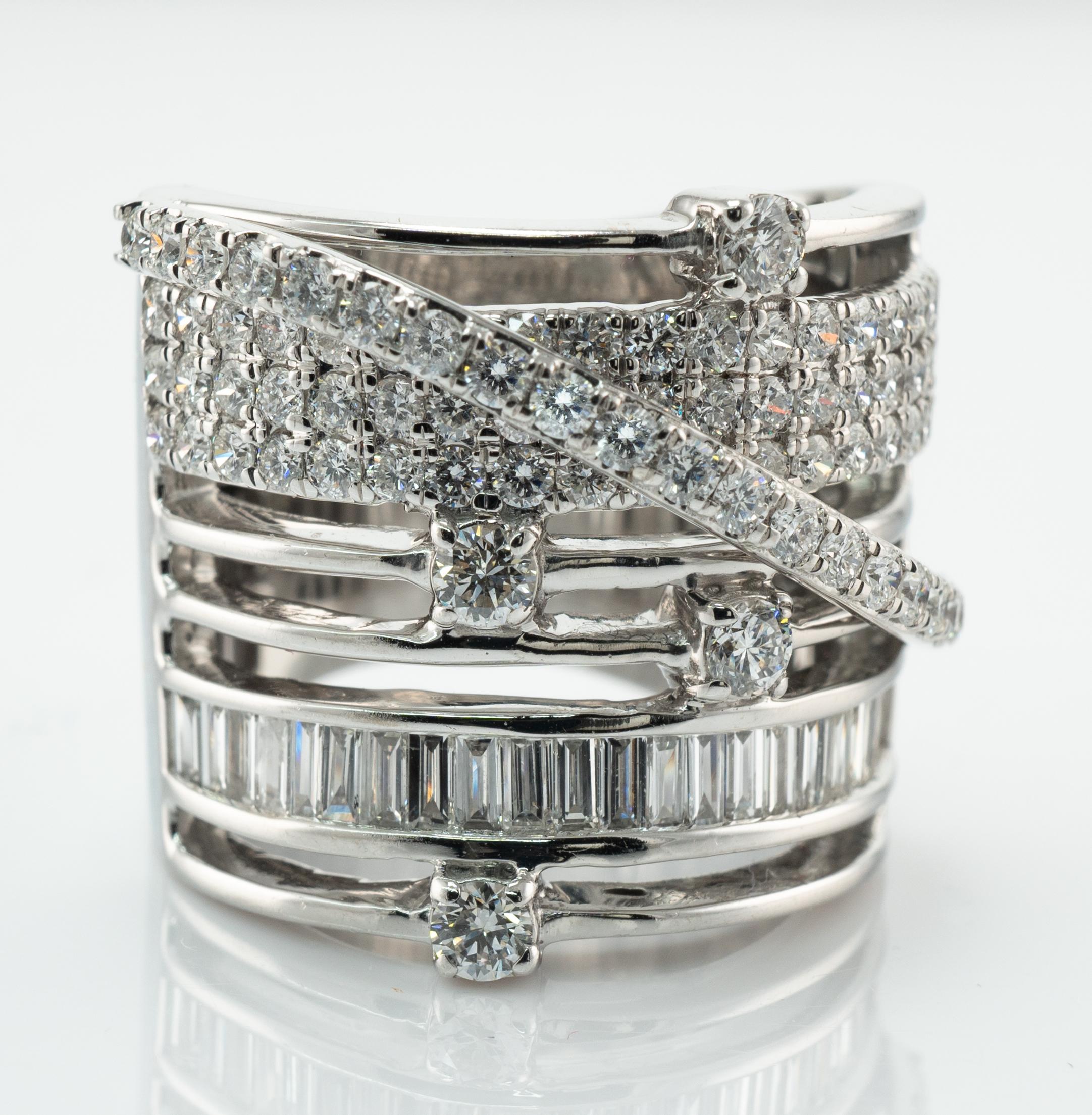 
Natural Diamond Ring Cigar Wide Band 14K White Gold 2.31ct TDW

This spectacular estate ring is finely crafted in solid 14K White Gold.
The cigar band holds 100 round diamonds and baguettes.
The total diamond weight is 2.31cts of VS2-SI1 clarity