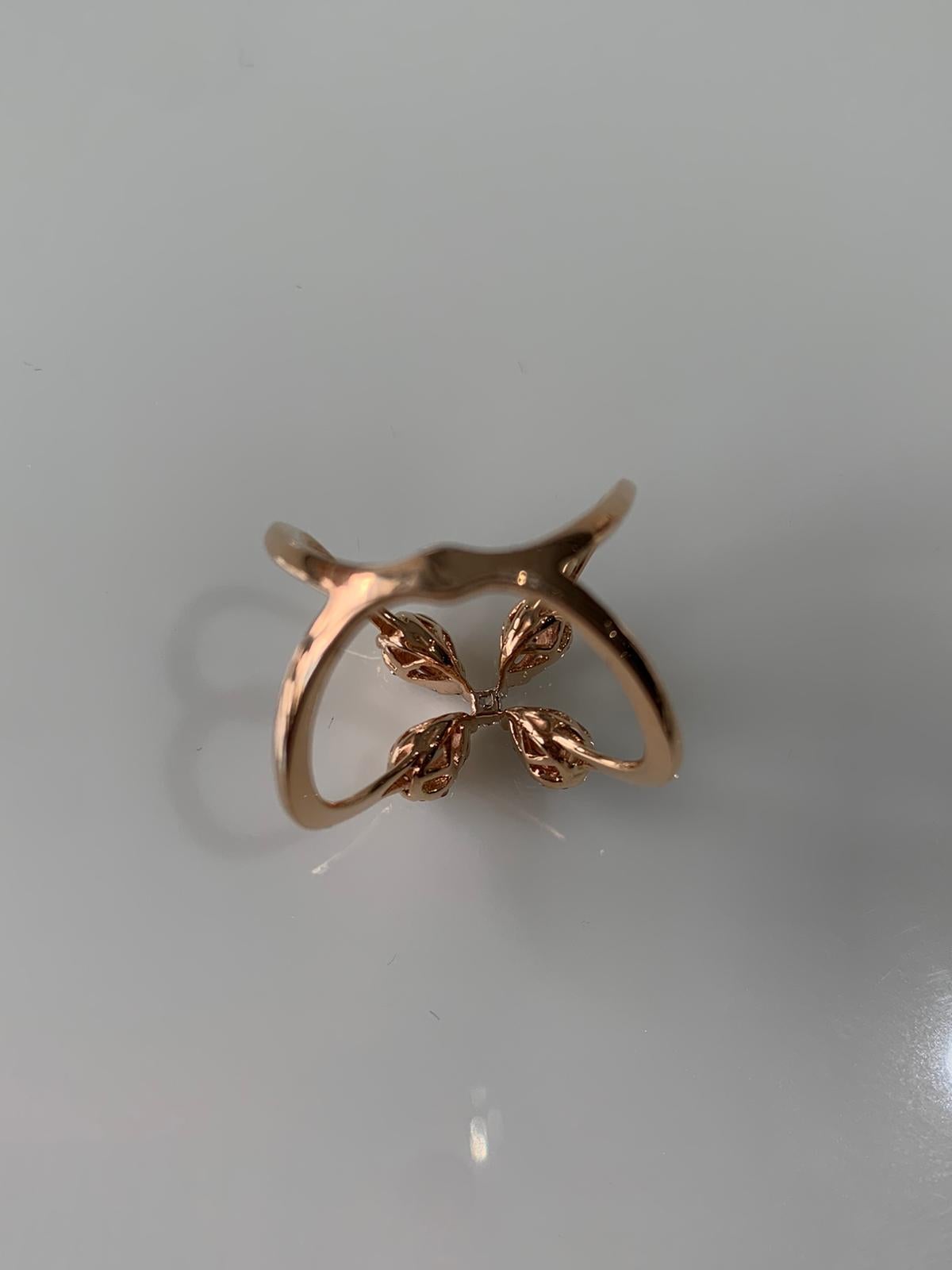 A beautiful and chic diamond pressure ring set in 18k rose gold . The diamond weight is .48 carats and net gold weight is 4.504 grams. The ring dimensions in cm 1.5 x 2.2 x 2.1 (LXWXH). US size 6 1/2.