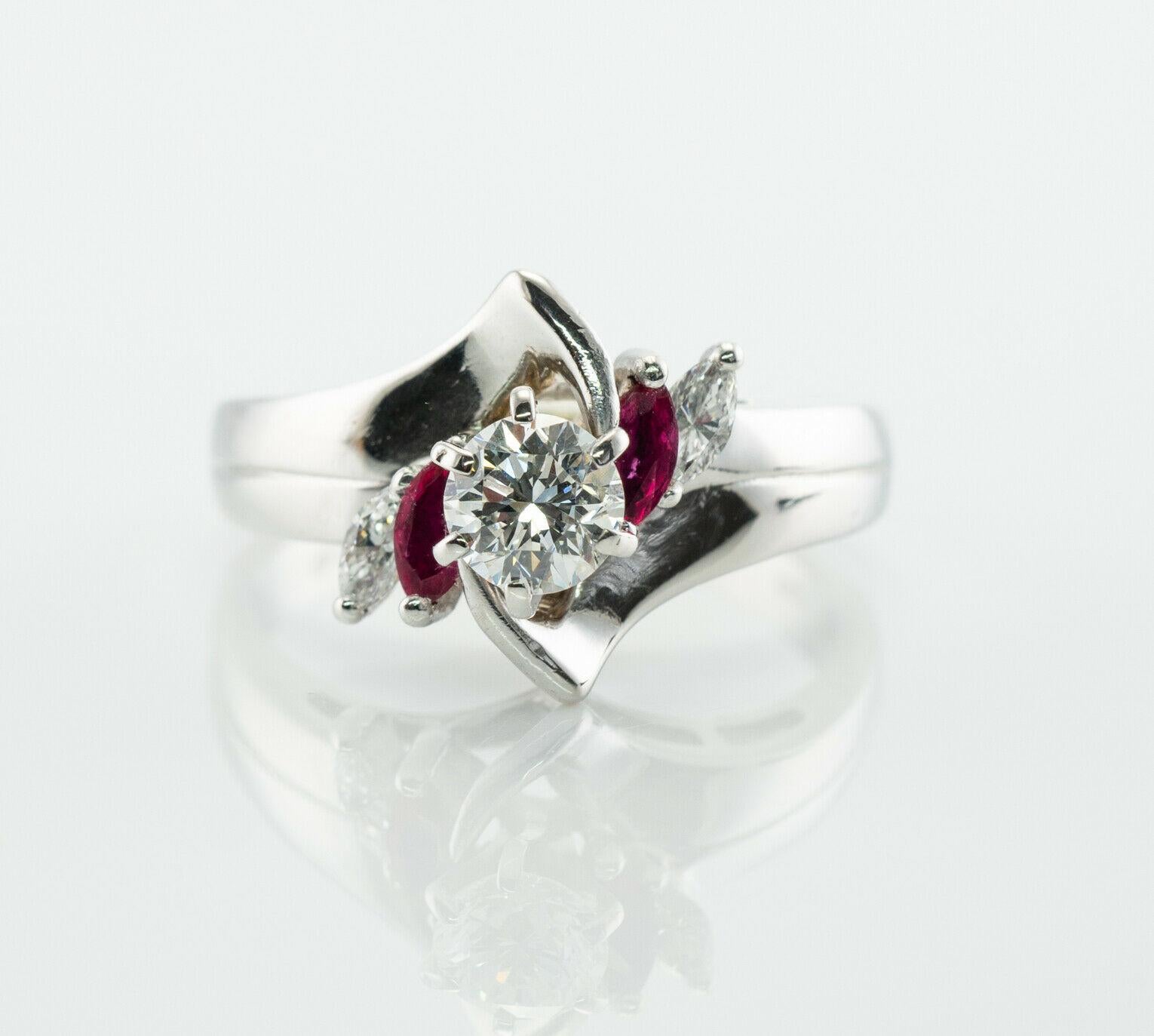 Natural Diamond Ruby Ring Flower 14K White Gold Band Vintage

This lovely estate ring is finely crafted in solid 14K White and set with sparkling natural diamonds and natural rubies. The center round brilliant cut diamond is .25 carat of VS1 clarity