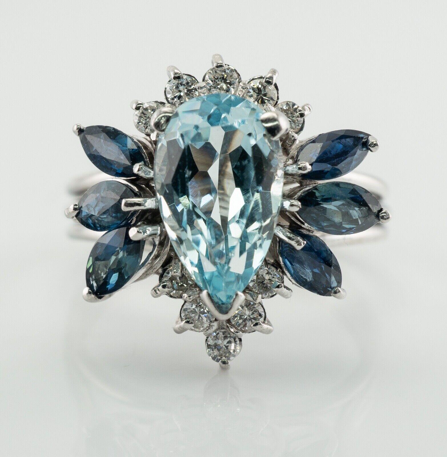 This estate ring is crafted in solid 14K White Gold
The natural Earth mined pear cut Aquamarine in the center measures 12mm x 7mm = 2.49 carats.
Six marquise cut natural blue Sapphires are 5x2mm and 5x3mm = 1.20 carats.
All colored stones are