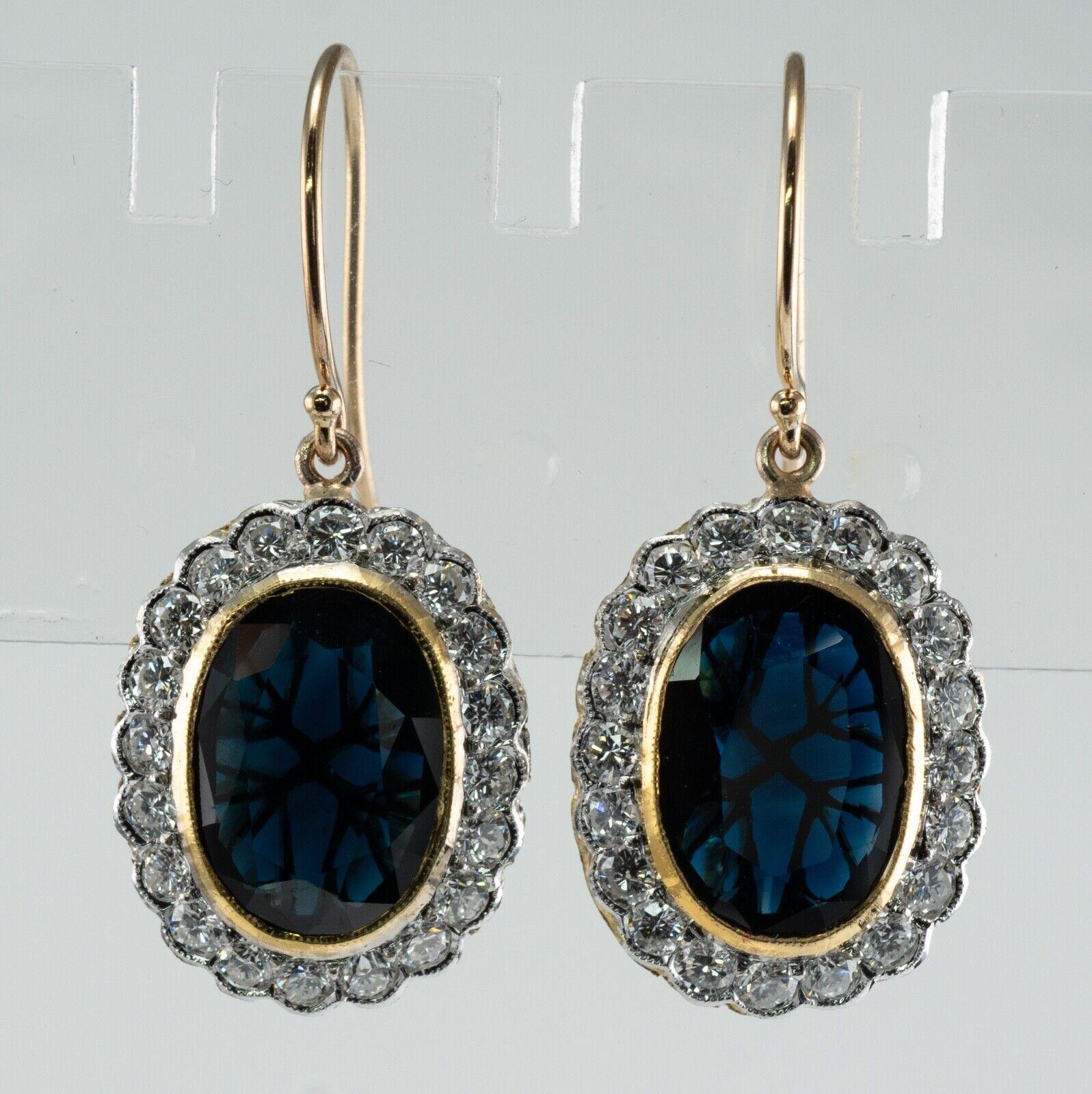 This vintage pair of earrings is crafted in solid 14K Yellow Gold (stamped on the hook backs).
The center oval cut Sapphires measure 11x9mm totaling 7.60 carats for the pair.
The sapphires are very intense blue in color.
One gem has a tiny chip on