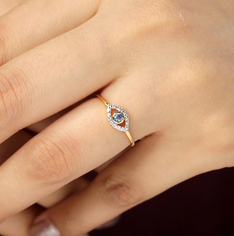 This truly eye catching evil eye diamond ring. It is Made with 14k yellow gold and sapphire gemstone and with sparkle diamonds. It is perfect for any jewelry collection.

Specifications:

Dimensions: Ring Size-7.25 Us, Top-6*15 MM
Gross Weight: 1.22