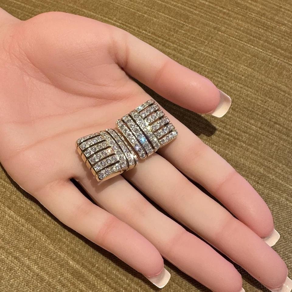 Pave Diamond Square Button Earrings 5 carat total weight in 18k Yellow Gold with 14k Yellow Gold Clips

Diamond Pave Earrings feature Round Brilliant Diamonds weighing approximately 5 carats in total, all set in a square shape 18k Yellow Gold