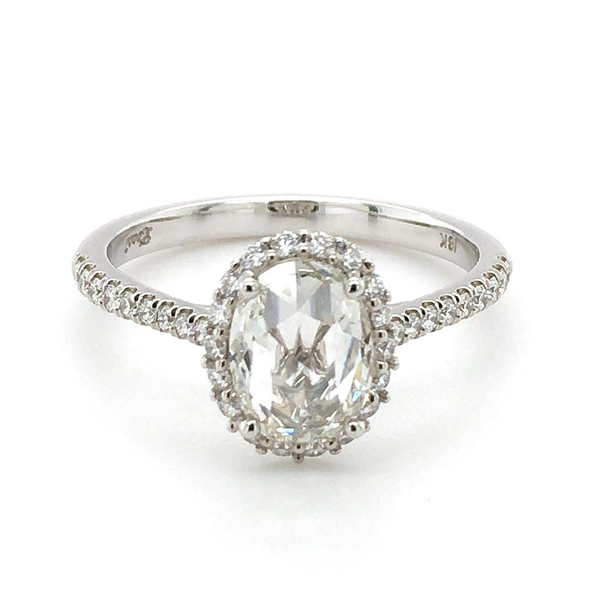 Discover exquisite 18K white gold ring features a captivating natural rose cut diamond, elegantly paired with accent diamonds. The unique oval-shaped rose cut center stone offers a vintage charm, while the surrounding diamonds add a touch of modern