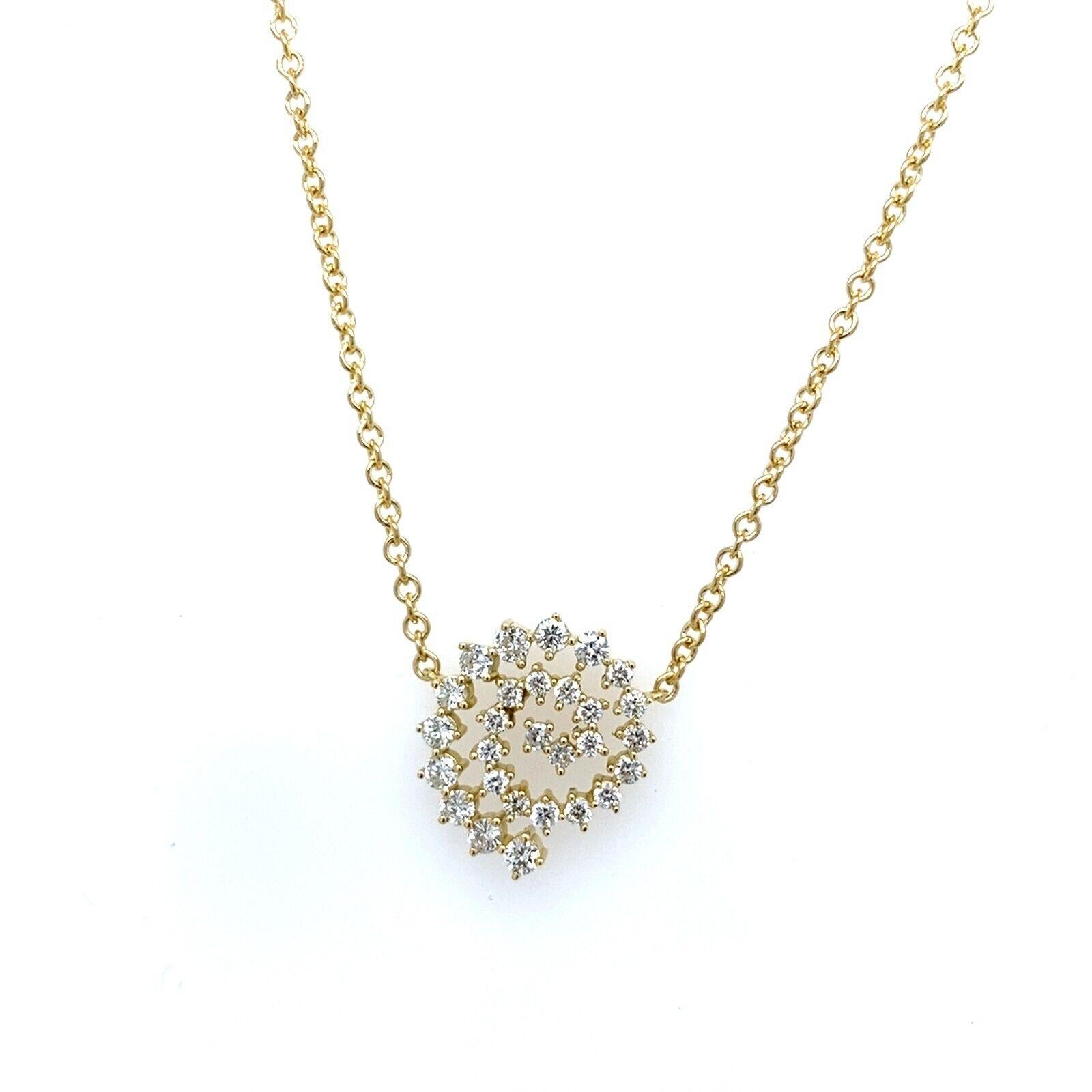 This beautiful diamond swirl pendant is a timeless symbol of memories kept close to your heart. Crafted in 18ct yellow gold, totaling 0.55ct of round brilliant cut diamonds,suspended on 18ct white gold chain, can be worn with a 16-inch or
