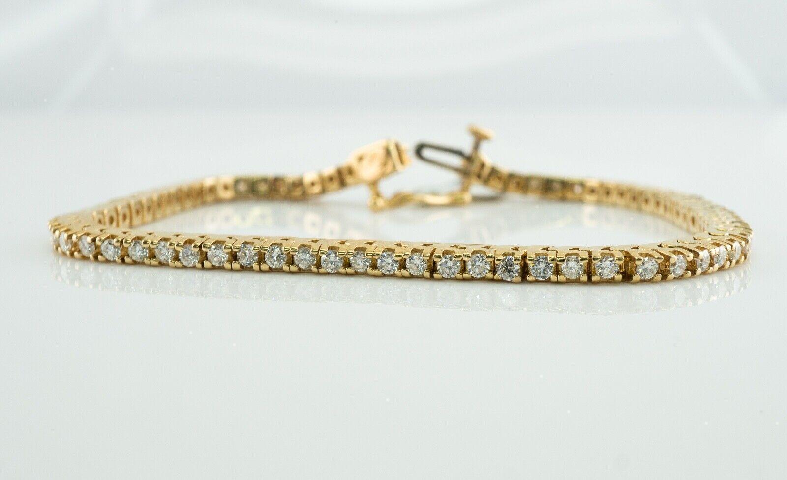 Natural Diamond Tennis Bracelet 14K Gold 2.02 TDW Tag $5685

This amazing estate tennis bracelet was a part of an auction parcel. It is crafted in solid 14K Yellow gold and set with white and fiery round brilliant cut diamonds. 
There are 72