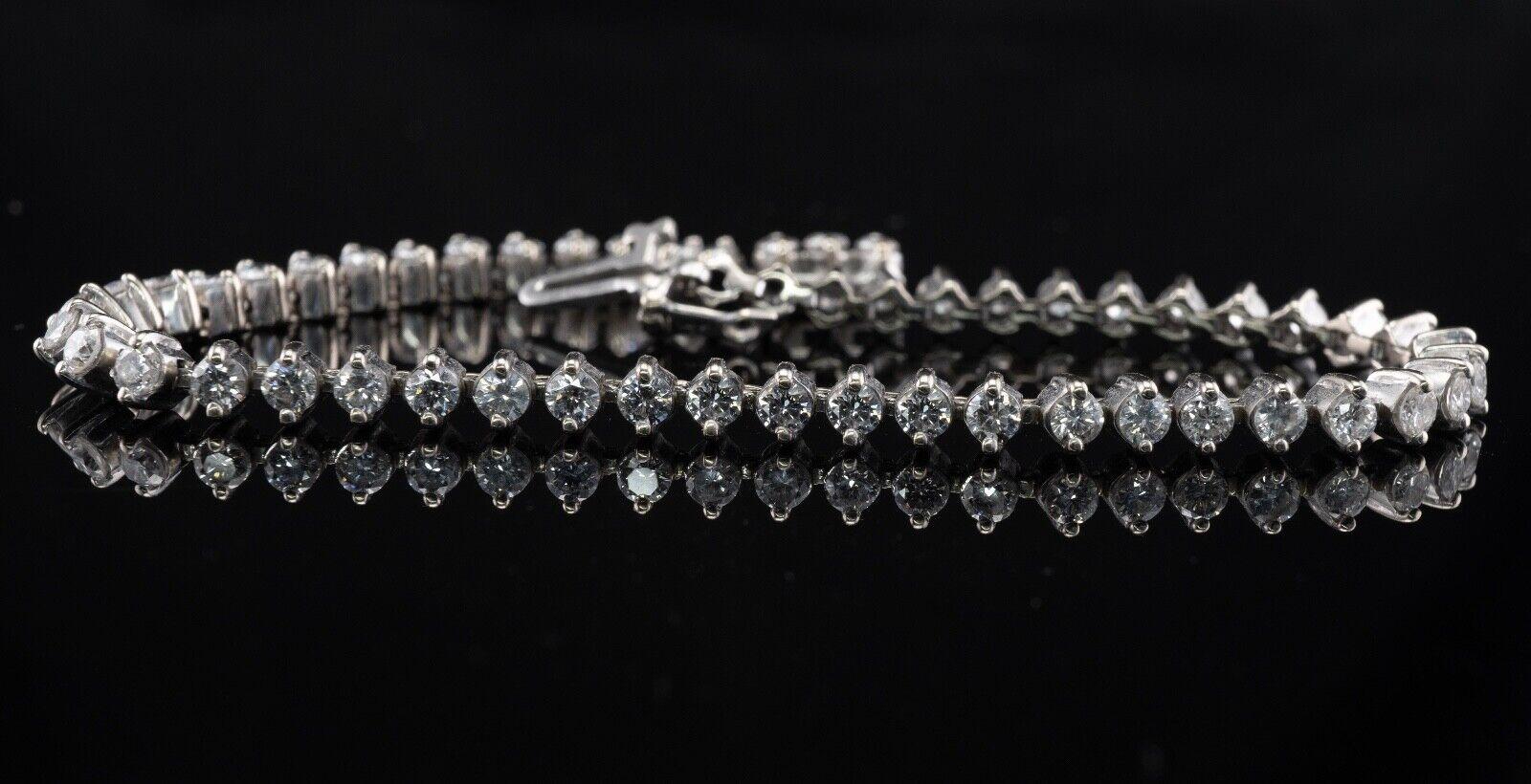 Natural Diamond Tennis Bracelet 14K White Gold 3.00 TDW

This amazing estate tennis bracelet is crafted in solid 14K White gold and set with white and fiery round brilliant cut diamonds. 
There are 55 diamonds of SI1 clarity and H color totaling
