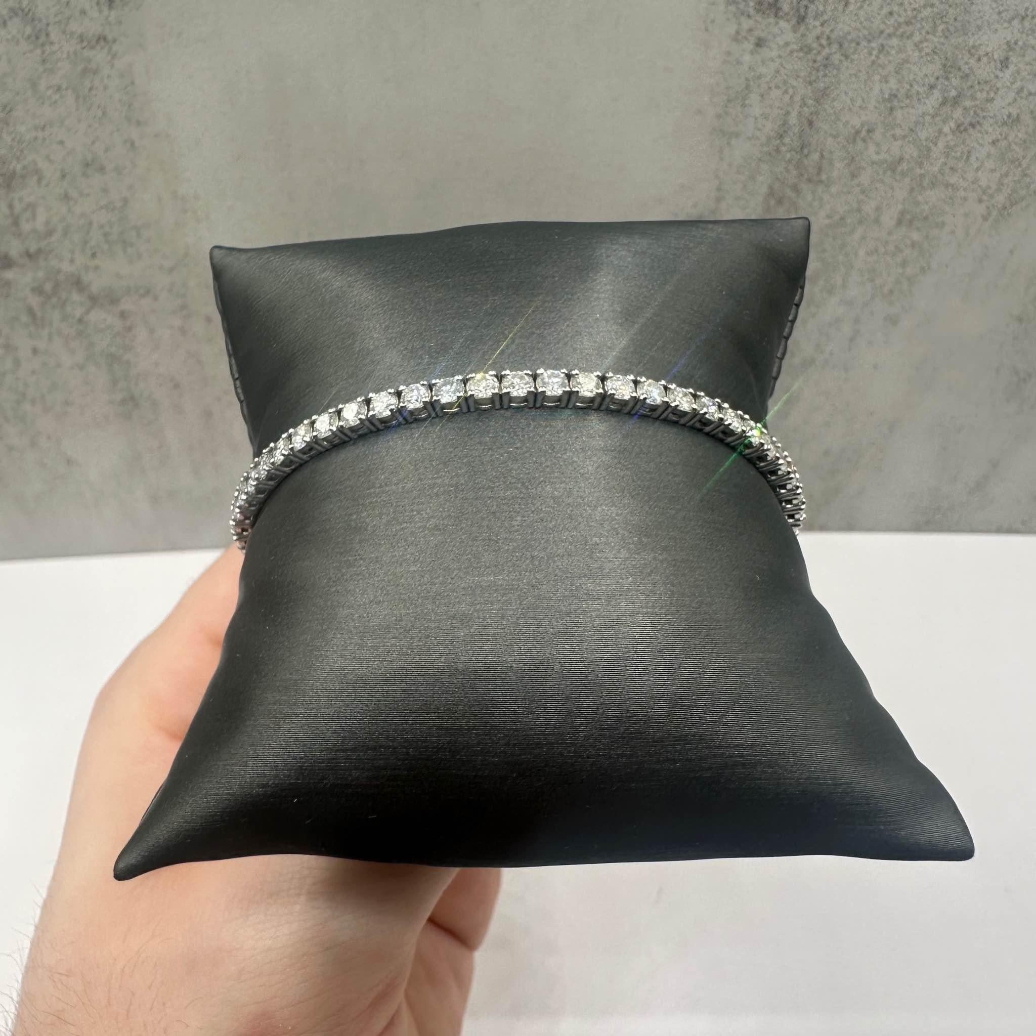 This stunning Natural Diamond Tennis Bracelet in 14kt white gold features 5ctw of natural GH SI2-I1 round diamonds, offering brilliant sparkle and elegance. The 7-inch length fits comfortably for most wrist sizes, and the bracelet weighs 10.4 grams