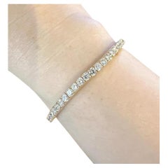 Bracciale tennis con diamanti naturali, peso totale 7,72 carati, oro giallo 14k