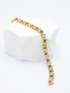 Natural Diamond & Topaz Tennis Bracelet set in 14K Yellow Gold