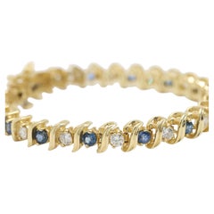 Natural Diamond & Topaz Tennis Bracelet set in 14K Yellow Gold
