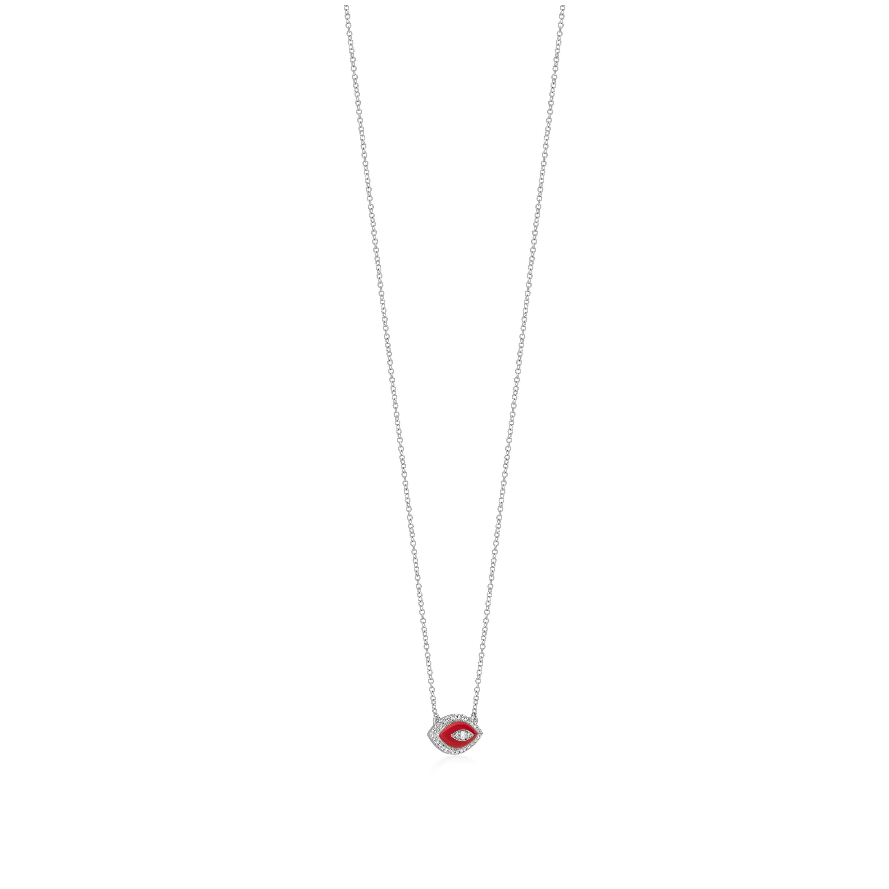 Questa collana in oro bianco 18 carati presenta un ciondolo unico a forma di occhio, splendidamente ornato di diamanti e smalto rosso al centro. La parte centrale mette in mostra uno splendido diamante rotondo, circondato da un'aureola di smalto