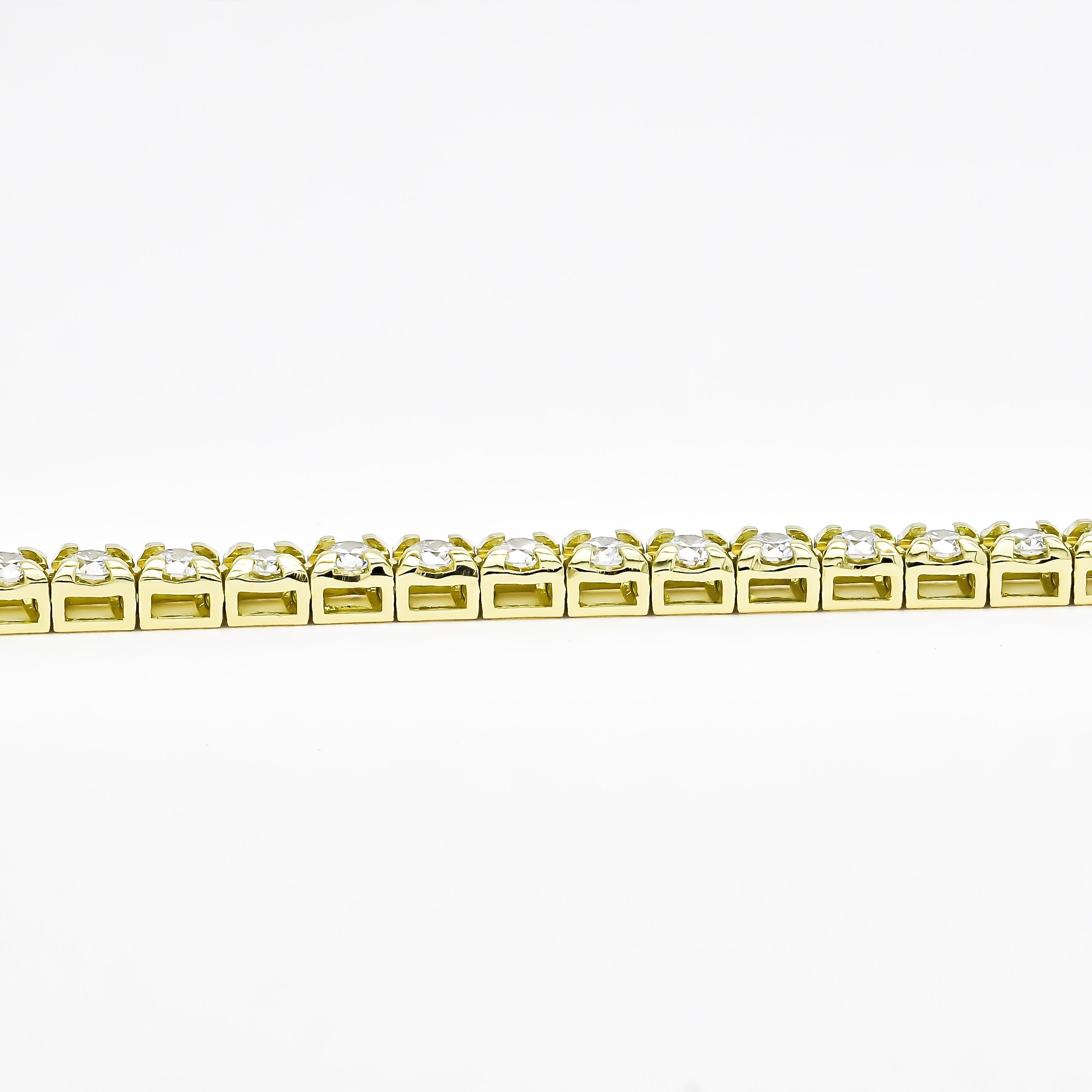 Elevate your style with this exquisite 18K Yellow Gold Four Prong Tennis Bracelet. Crafted with meticulous attention to detail, it features a continuous line of dazzling round-cut natural diamonds, totaling 2.82 carats. Each diamond is expertly