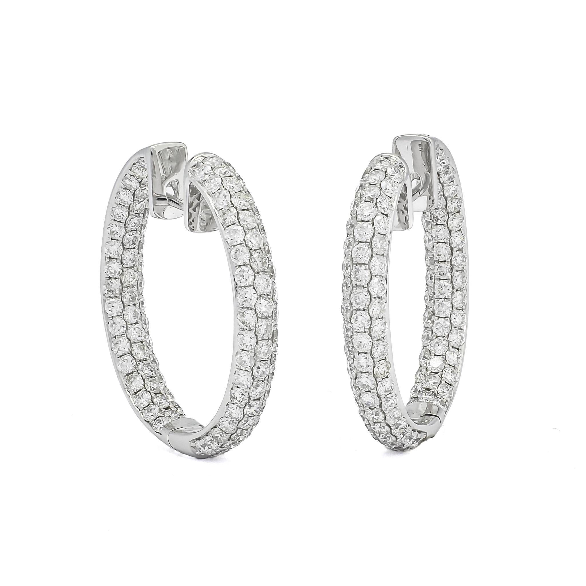 Presenting the 18KT White Gold Natural Diamonds In and Out 3 Row Hoop Earrings - a spectacular fusion of elegance, luxury, and sophistication. These earrings are the epitome of high-end jewelry design, sure to capture the heart of any woman who