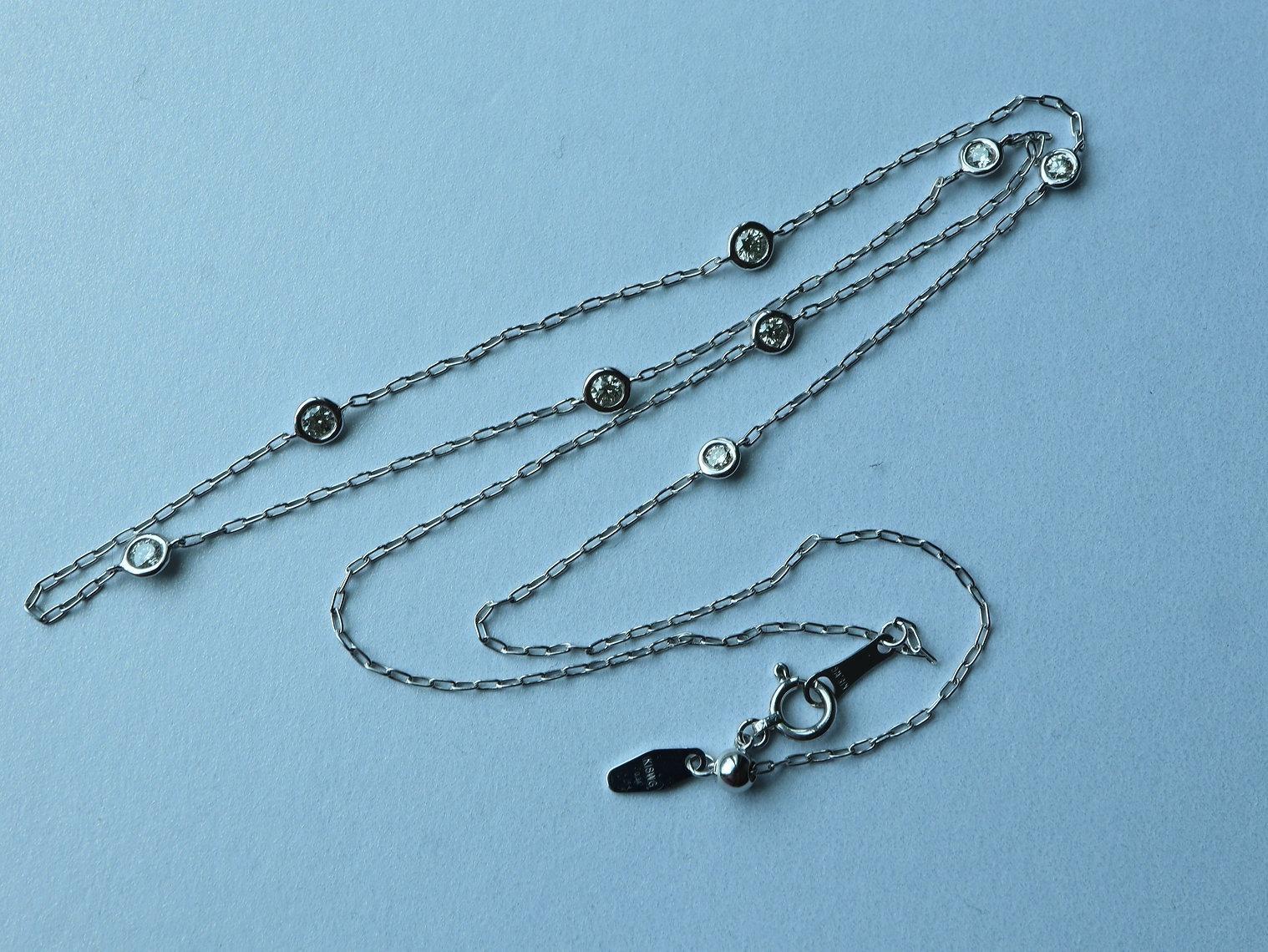 
This simple minimalist design includes 8 natural diamonds that float around the neck on a dainty chain. Most importantly, every single stone is an earth-mined natural diamond, Brilliant Cut, GH color, VS clarity. The length is flexible and can be