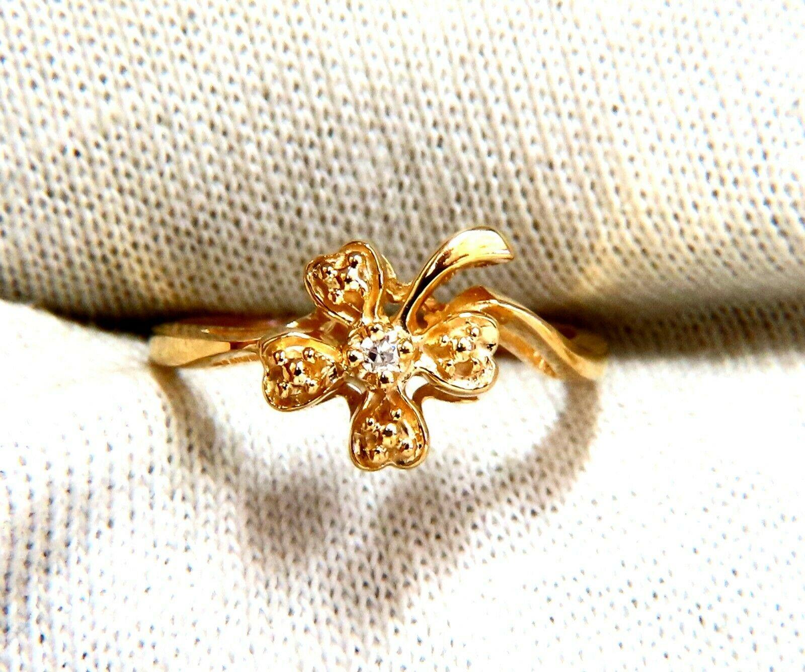 Irish Clover Deco

.03ct  Natural Round Cut Diamonds. 

14kt yellow gold

2.9 Grams

Overall ring: 9.8mm wide

Depth: 5.6mm

Current ring size: 7.75

May professionally resize, please inquire.