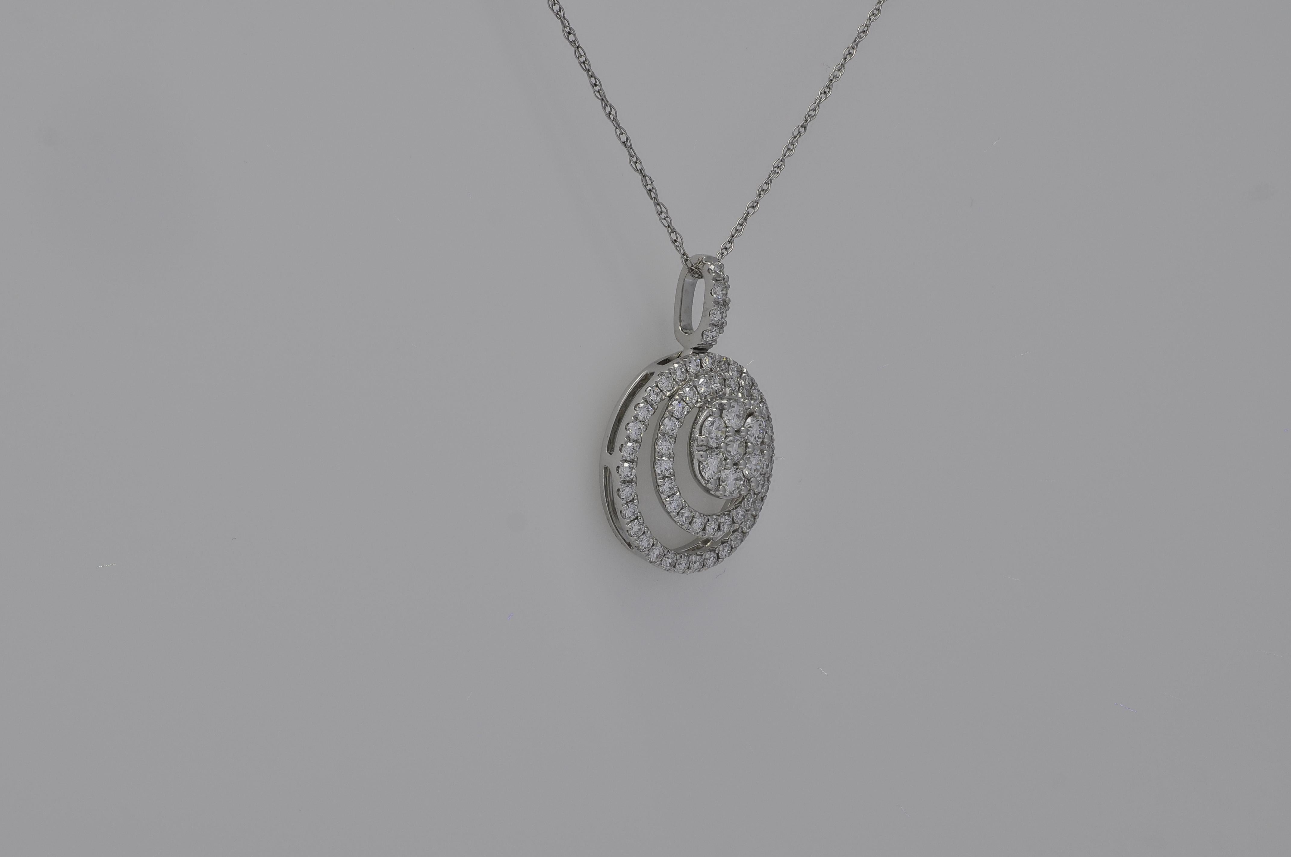 This pendant necklace is a true masterpiece of craftsmanship and elegance. It features a breathtaking cluster of round-shape diamonds, meticulously arranged to create a sweet and sparkling focal point. The diamond cluster is further enhanced by a