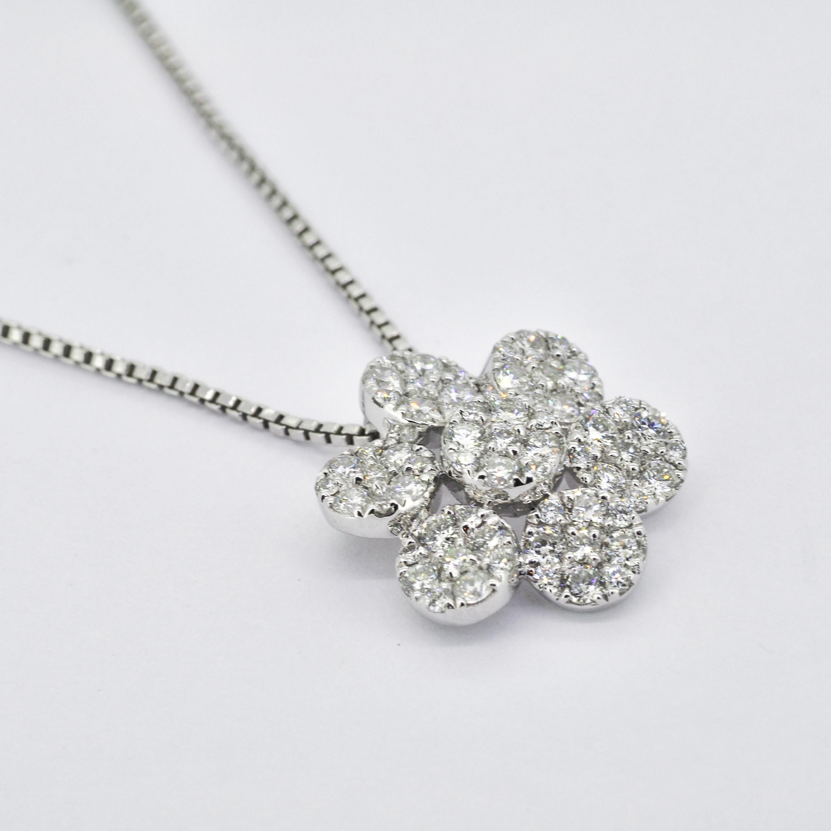 Immerse yourself in the captivating beauty of this Natural Diamonds Pendant, a luxurious piece that exudes sophistication and timeless elegance. 

The design features a Women's Diamond Cluster Pendant, beautifully crafted to resemble a delicate
