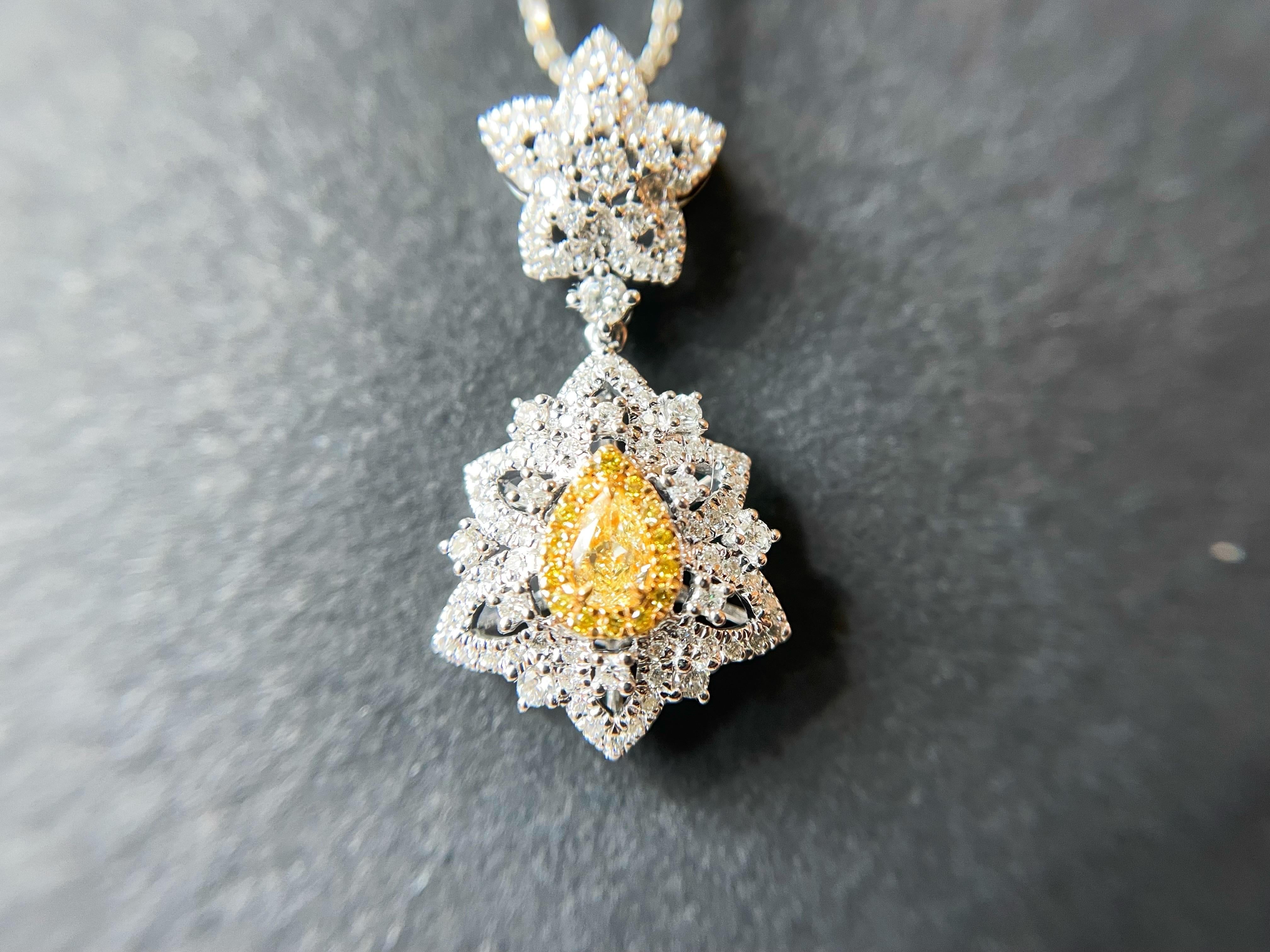 Pear Cut Natural Drop Shape Yellow Diamond Pendant set in 18K White Gold with Diamond  For Sale