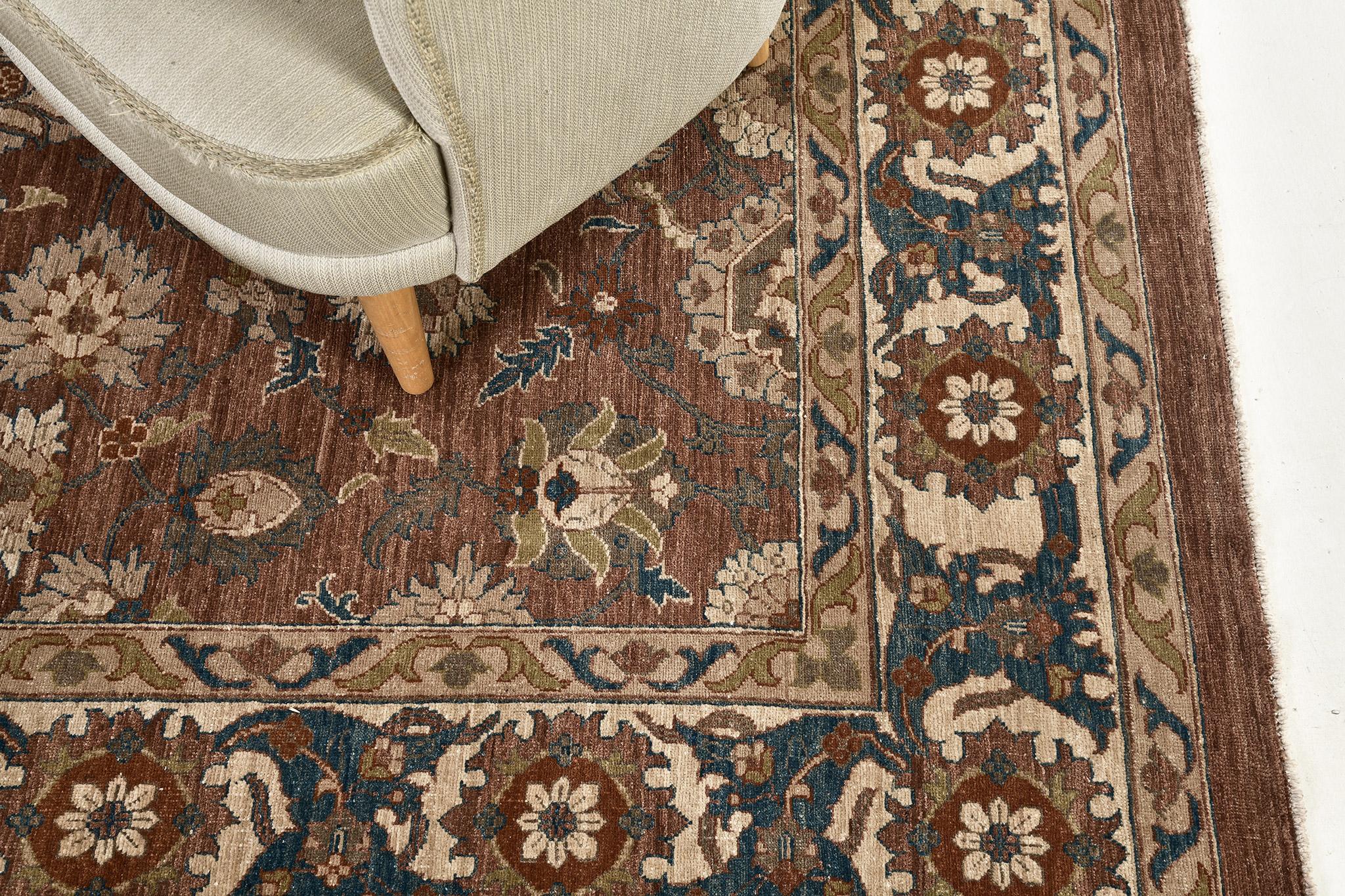A sophisticated hand-spun wool Agra Rug revival that entices every designer to create a home space with elegance. The color balance of aegan blue, mahogany red and linen of this masterpiece complement with the symmetrical full bloom florid design