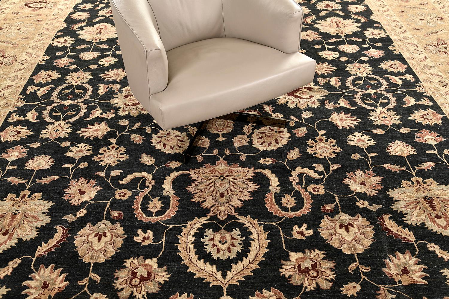 Featuring brilliant array of floral forms, leafy tendrils and lush palmettes, this elegant Agra revival rug was influenced by different traditions and cultures. Through the use of a brilliant color scheme establishing points of embellished dainty