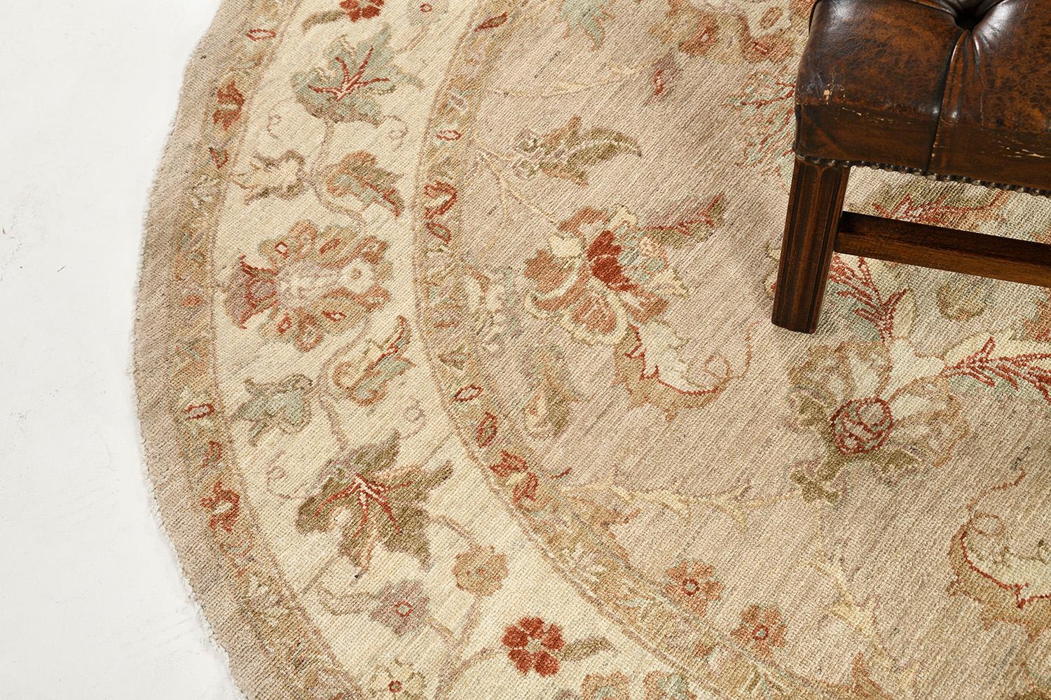 Get intrigued by this Agra Rug that features a floral design that complements the gray hues scheme. Series of symmetrically leafy scrolls, tendrils, and blooming elements are featured in a neutral-toned round-shaped rug. Perfect for your home