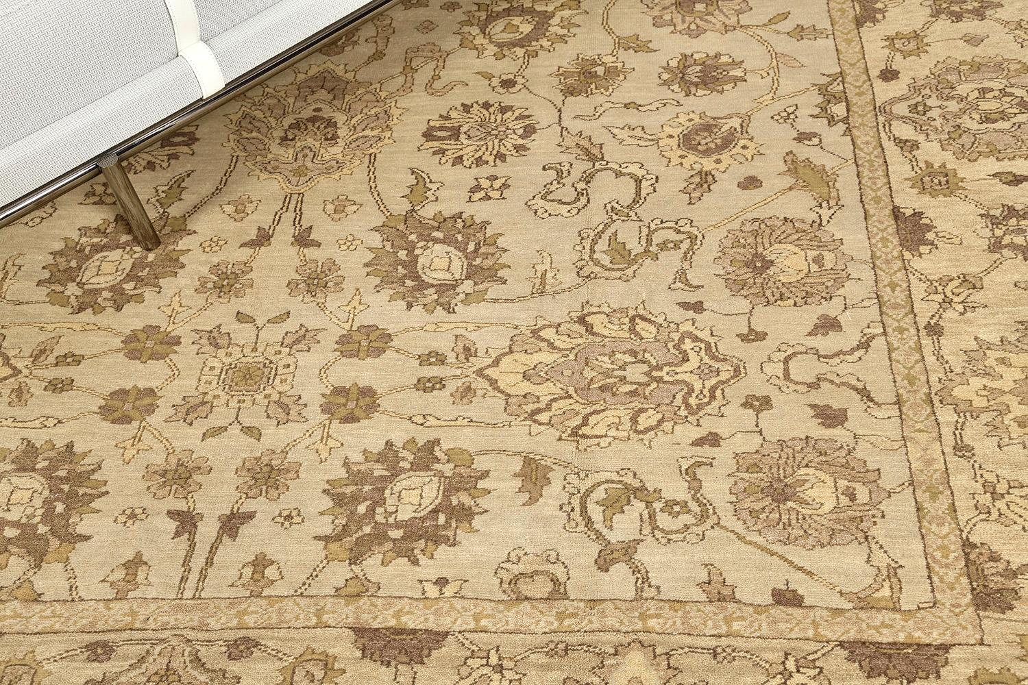 Wonderful vines and florid adornments are expressed through gold embellishments to blooming and fascinating oatmeal fields. The borders are beautifully woven that created vigorously to form an elegant Zigler rug. Truly an extraordinary creation that