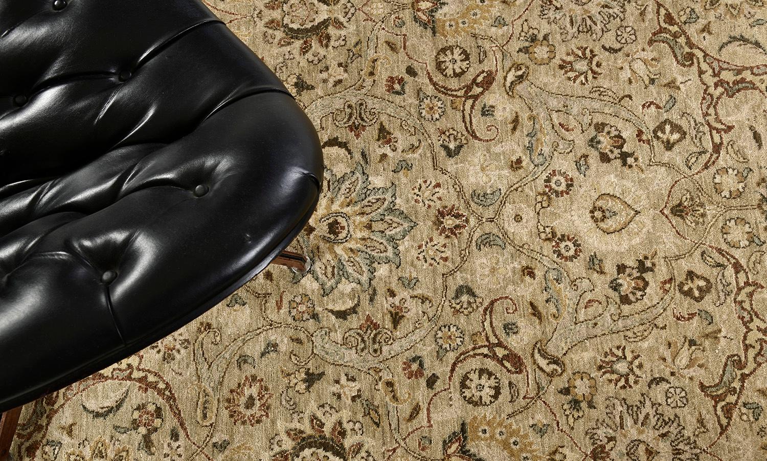 A sophisticated Indo Lahore revival rug that features the warm tones of ivory and sand in the most sought after earthy colour palette. The all-over majestic botanical patterns of floral sprigs, blooming palmettes, curled sickle leaves and stylized