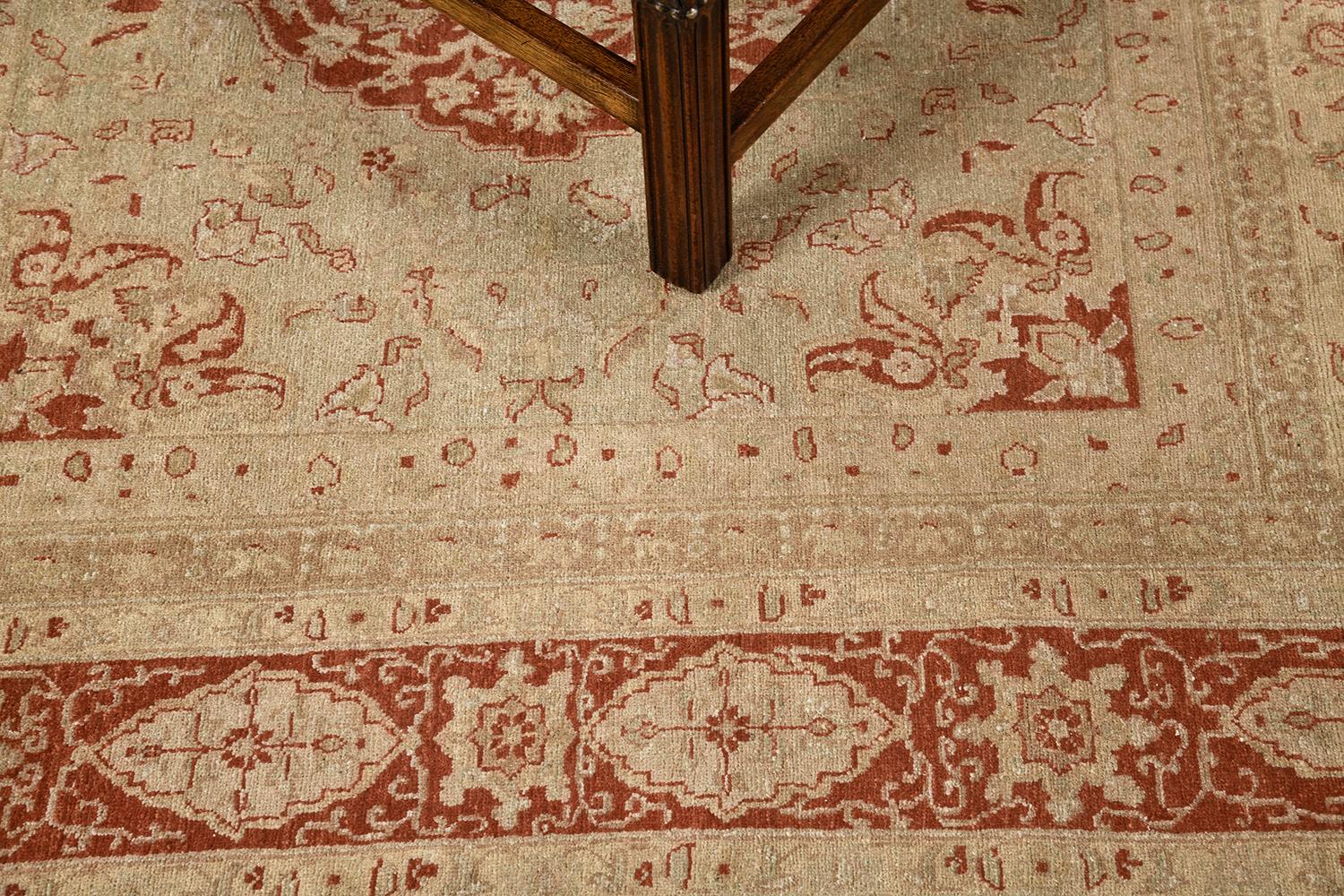 Mohtasham is a stunning pile of woven wool that features stylized medallions that forms grandiose diamonds in every pattern. It is surrounded by symmetrical embellishments that match the rosy and fresh spring fields of this masterpiece. A