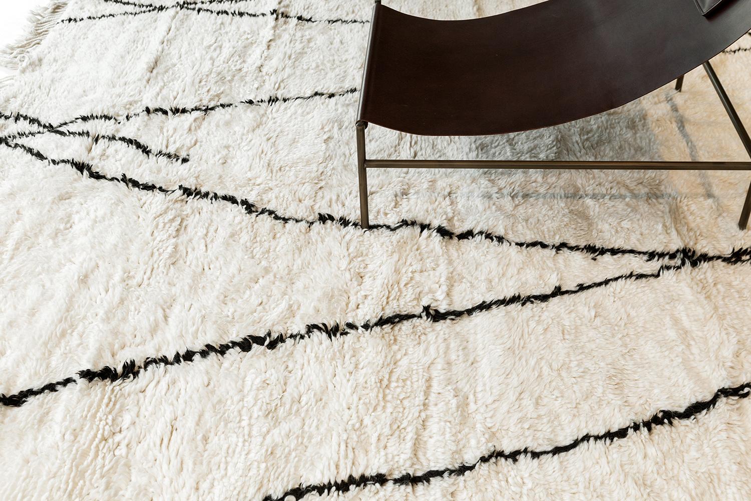 An inviting Natural Dye Moroccan Style in Denali Collection that provides the viewer a sense of comfort and style. This versatile rug features the lines that are indefinitely going towards their respective directions forming X motifs of the Berber