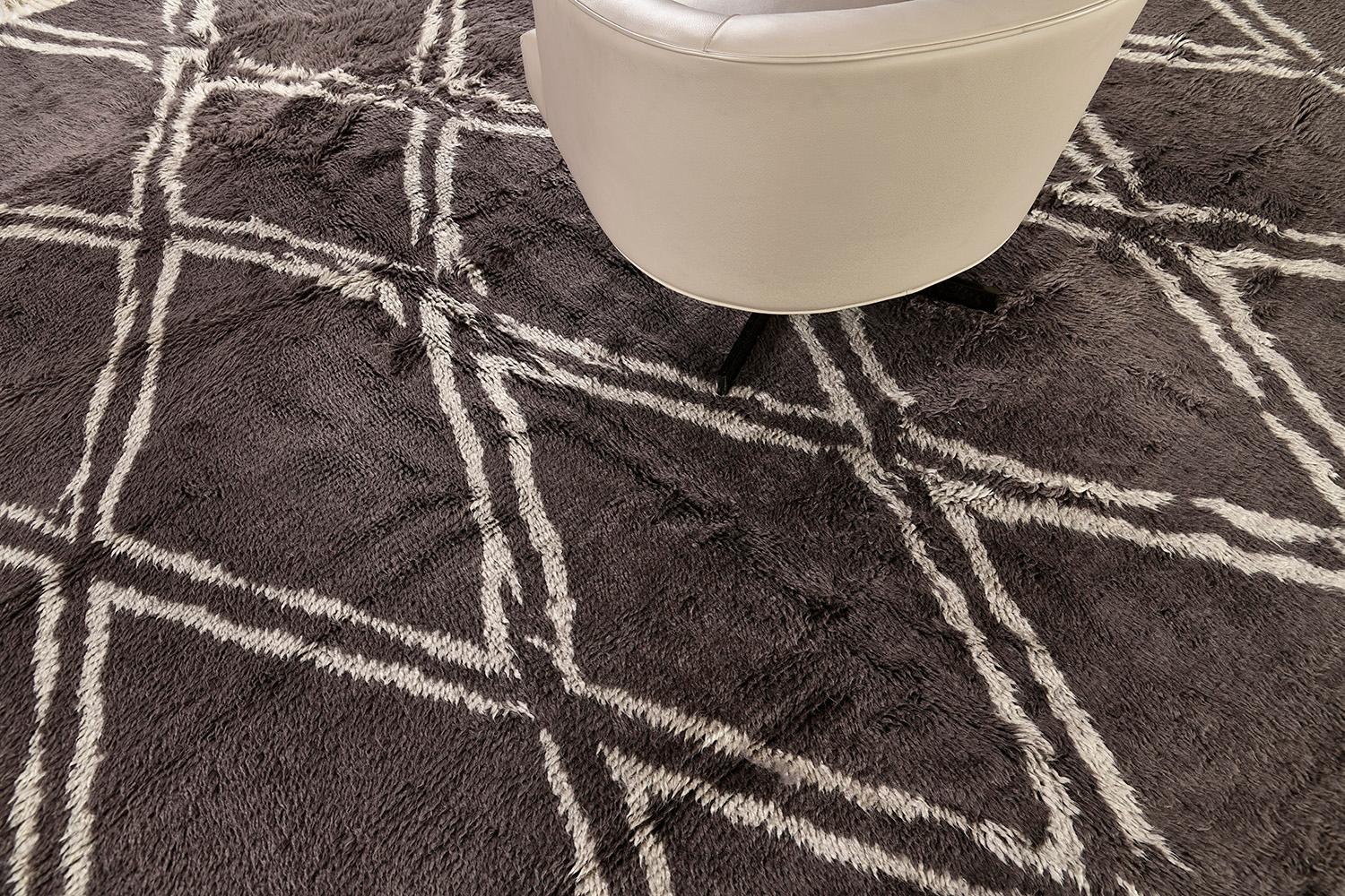 Palisade is a hand-spun wool shag that has a linear pattern that formed a series of diamonds. The rug has a charcoal and ash outline that makes the masterpiece unique. It fits perfectly with modern interiors and contemporary themes.


Rug number