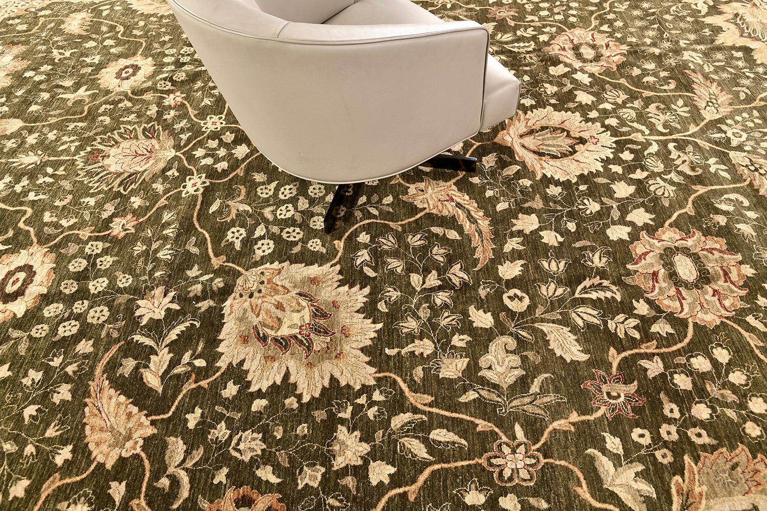 This stylish revival of Ottoman rug has a mirrored pattern of elegant floral scrolls and vine-formed motifs of gold, black, and tans with symmetrical motifs of borderlines. This masterwork of art utilizes earthy and clay tones to create a warm and