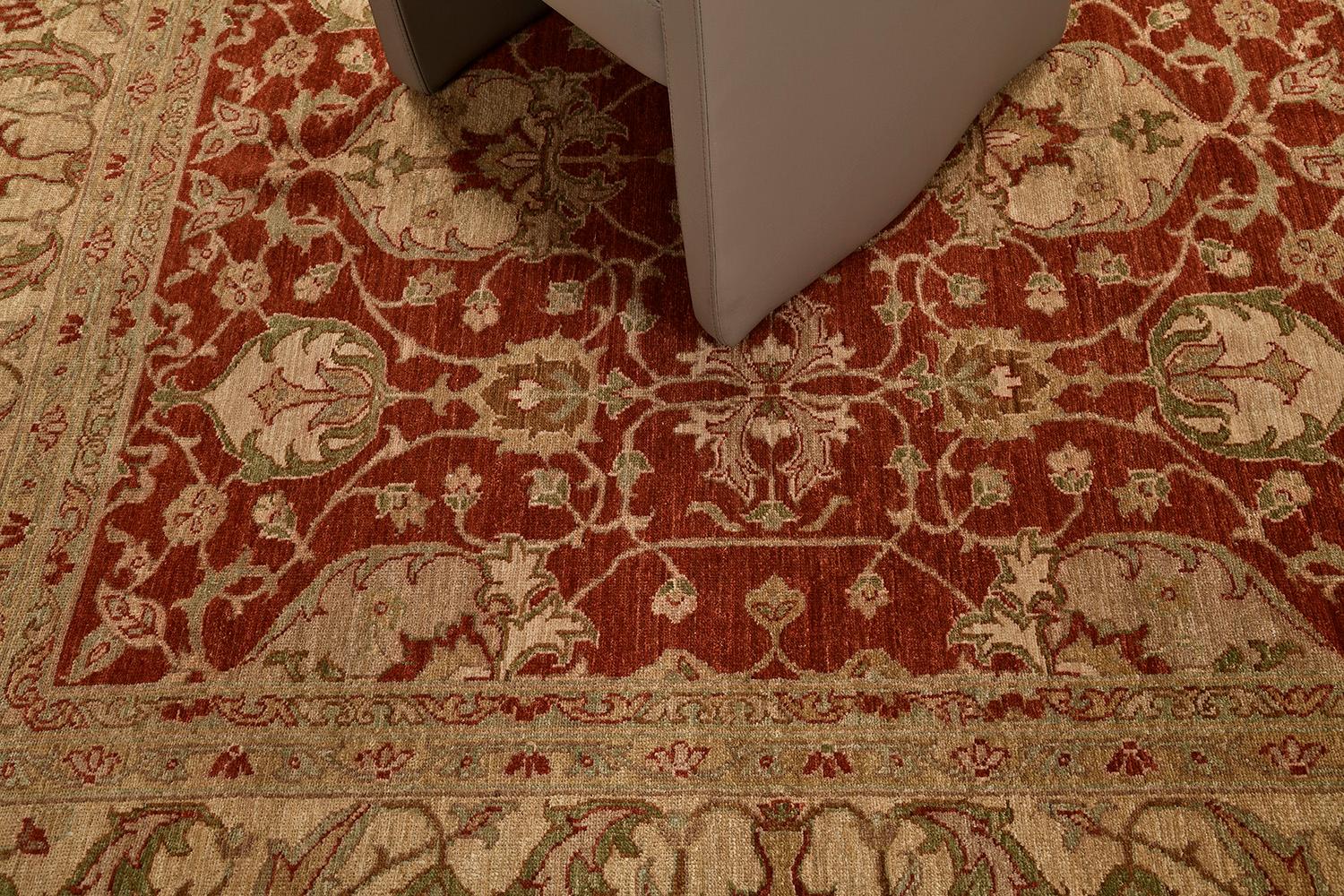 This mesmerizing Oushak design from our collection is the definition of perfection, elegance, and refinement. It features dazzling details in gold red. Breath-taking symmetric leafy tendrils and scrolls, and sets of florets,  that makes the carpet