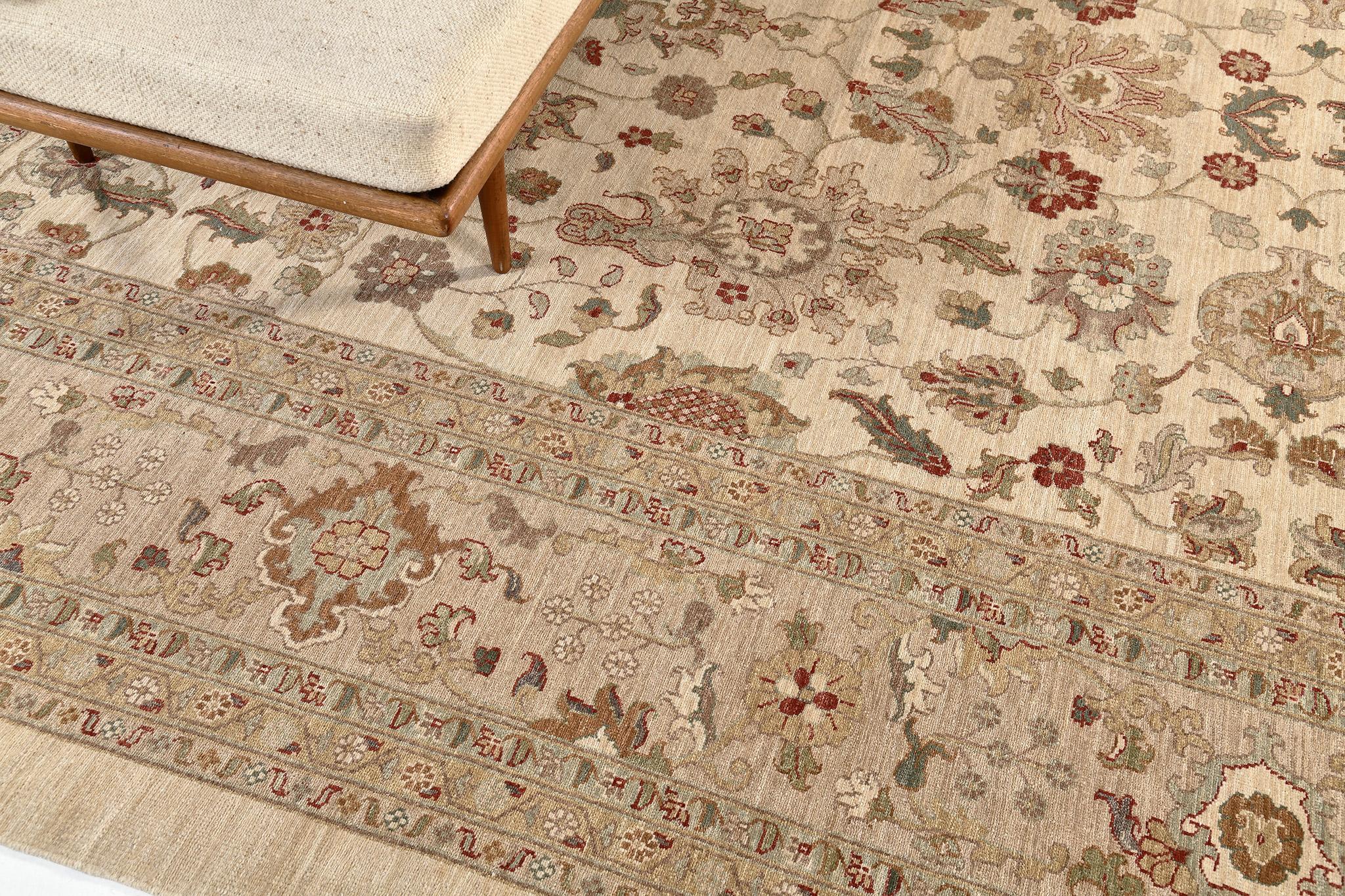 A magnificent Sultanabad revival rug made from hand spun wool and natural dye that will give your space a sense of elegance and charm. Embodying the stunning details of palmettes and tendrils strewn gracefully across an exquisite taupe field that is
