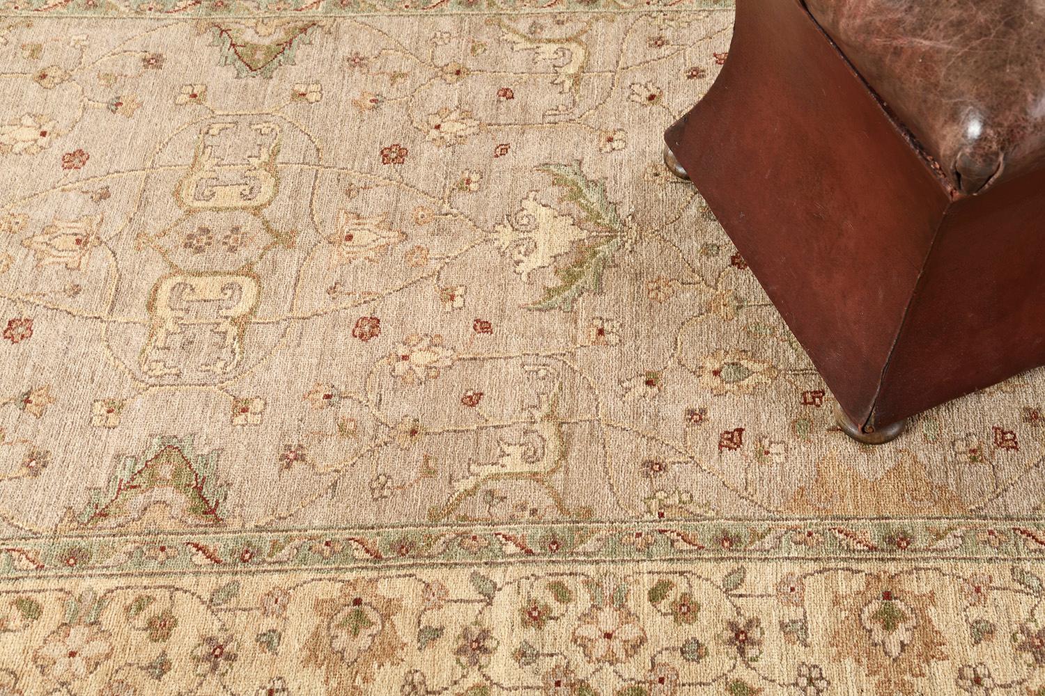 Series of florid ornaments are reflected through neutral-toned embellishments to blooming and dazzling brownfields. The borders are beautifully hand-woven that created from a vegetable dye to form an elegant Sultanabad Rug. Truly a Divine creation