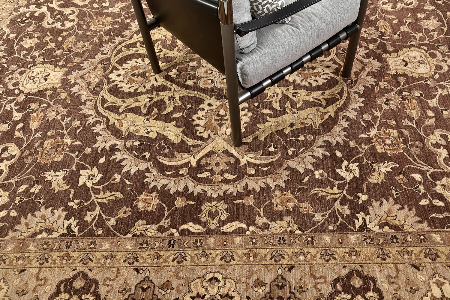 This dramatic revival of the Hadji Jalili rug has an intricate mirrored pattern of the symmetrical elegant floral scroll and a controlled ambiance of luxurious neutral tones with symmetrical motifs of borders. This masterwork of art utilizes cozy