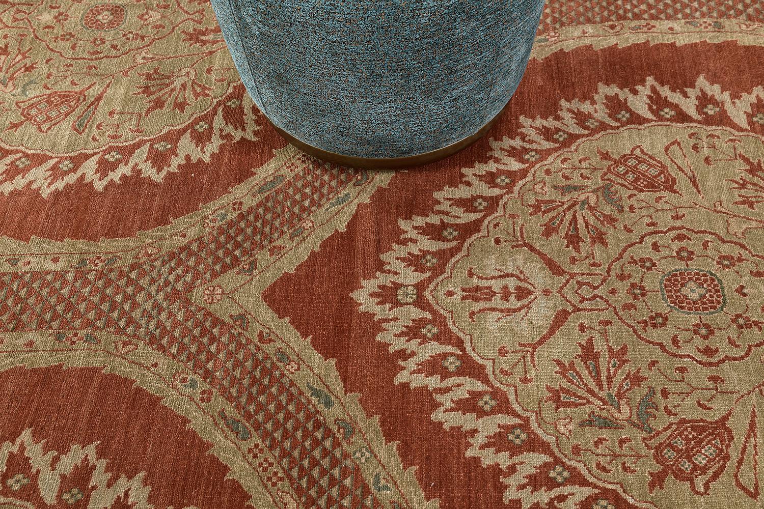 A meticulously hand-spun wool Transitional design from our most sought-after collection has come and flexed its versatility.  Stylized motifs, leafy tendrils, and bent outlines in a terracotta field manifest the entire pattern of the rug. This rug