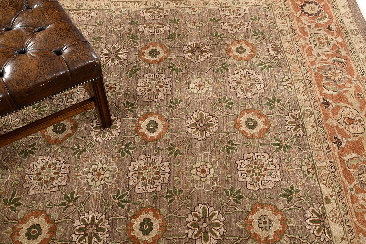 Known as the most authentic in terms of traditional style and motif, this iconic revival of Varamin rug features tones of camel, tan, and some touch of green. Meticulously hand-woven details where ornate flowers are aligned repeated all over the