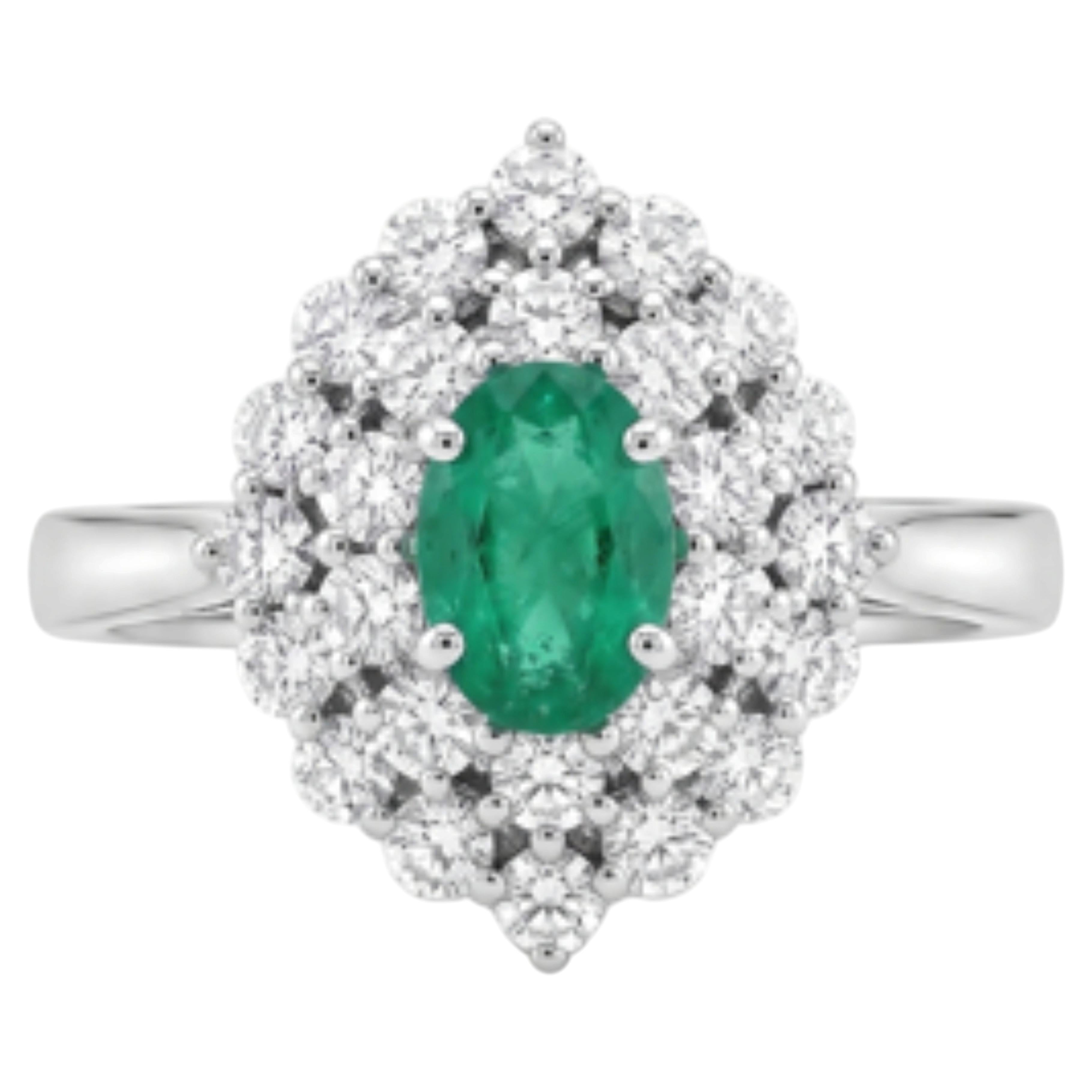 Emerald and Diamond Halo Ring in 18K Gold For Sale