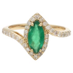 Anillo con esmeralda de 0,80 ct y diamantes de 0,38 ct en oro amarillo de 14K