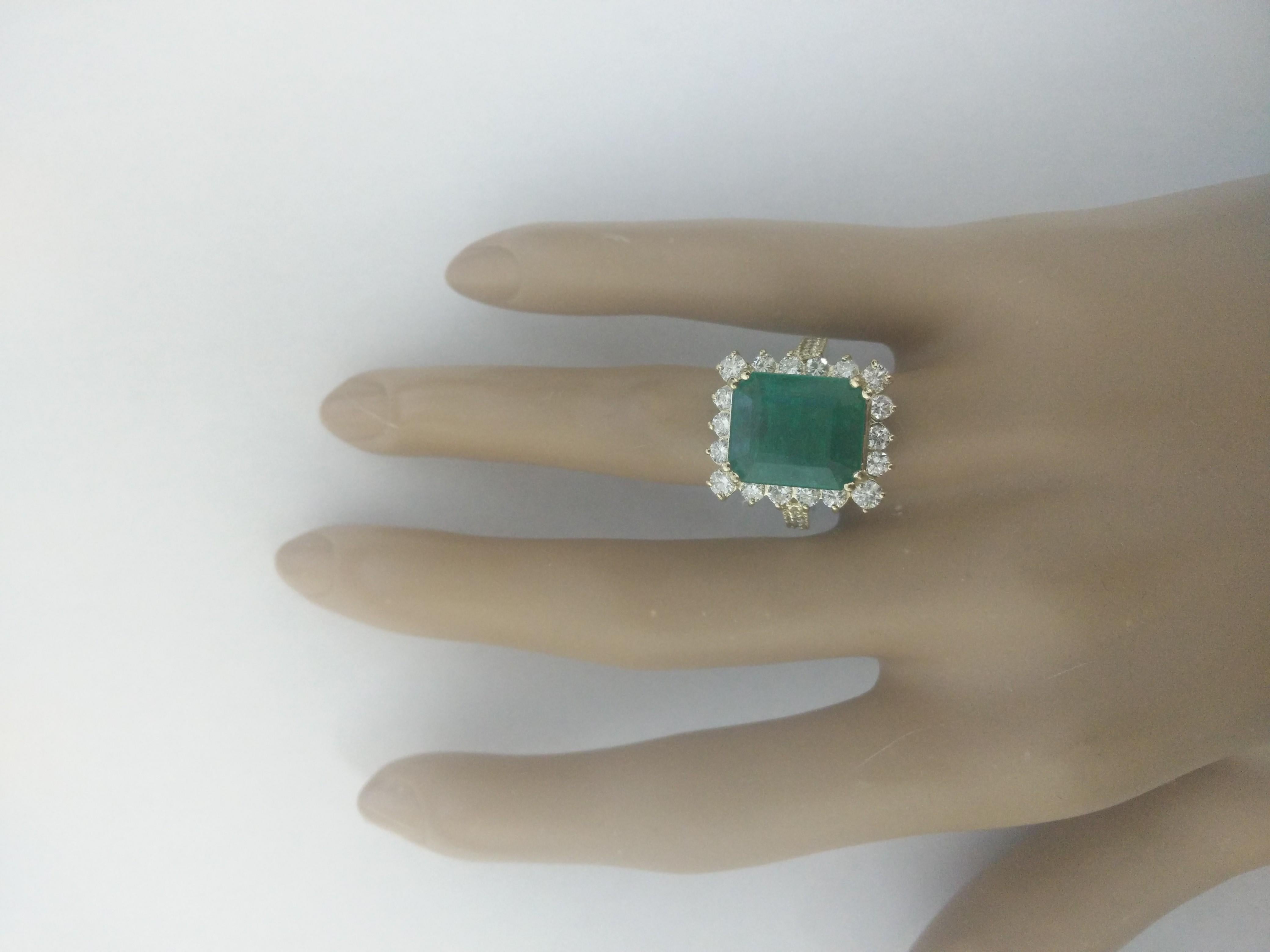 6.91 Carat Natural Emerald 14 Karat Solid Yellow Gold Diamond Ring
Stamped: 14K
Total Ring Weight: 9.2 Grams 
Emerald Weight: 5.51 Carat (13.00x11.00 Millimeters)  
Diamond Weight: 1.40 Carat (F-G Color, VS2-SI1 Clarity )
Quantity: 28
Face Measures: