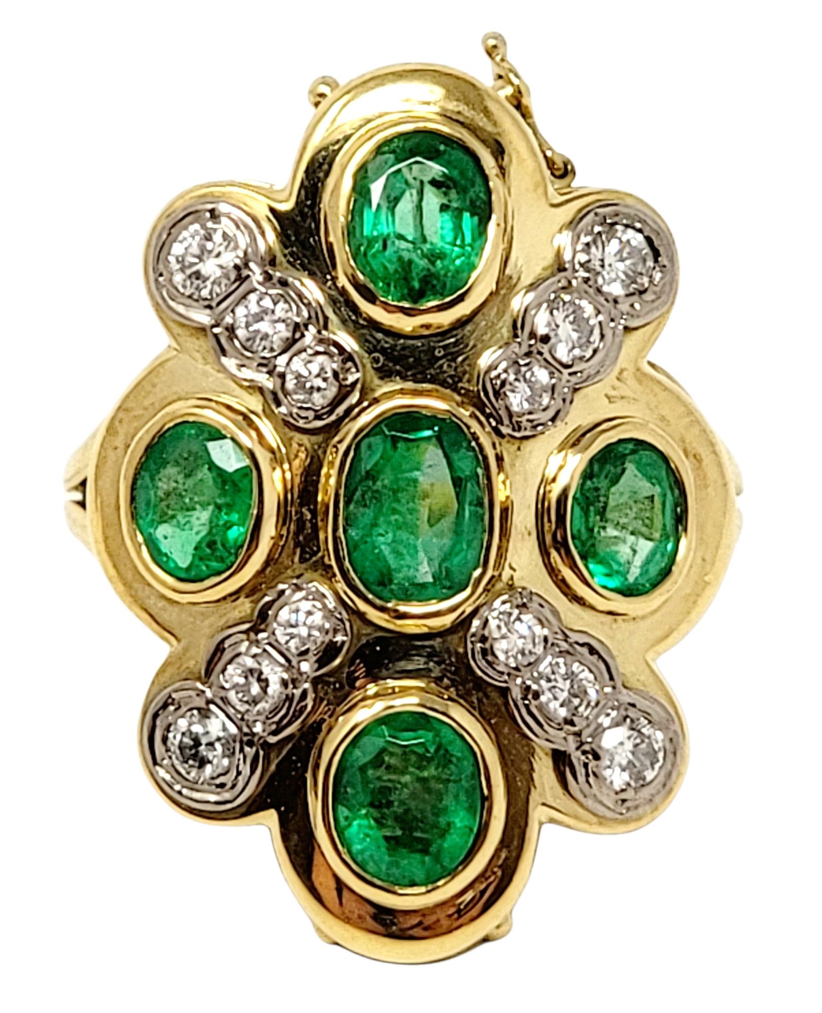 Ring size: 7

Stunning 18 karat yellow gold emerald and diamond cocktail ring is substantial in size and offers a stunning pop of color as it fills the finger. This unique piece can also detach from the ring base and be worn alone as a pendant