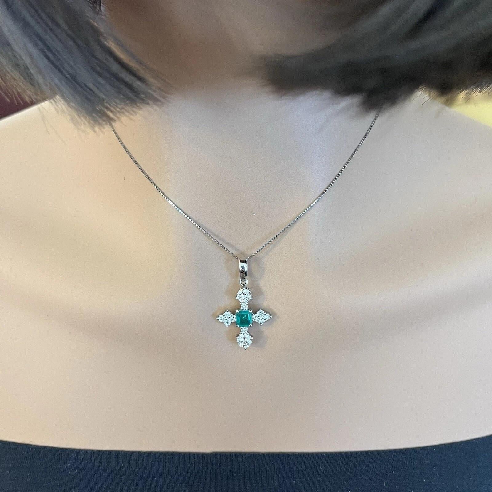 Emerald and Diamond Cross Pendant Necklace in Platinum 

Natural Diamond and Emerald Cross Pendant features a Natural Square Emerald cut Emerald center accented with Round Brilliant Diamonds, all in a Platinum setting forming a cross pendant.

Total